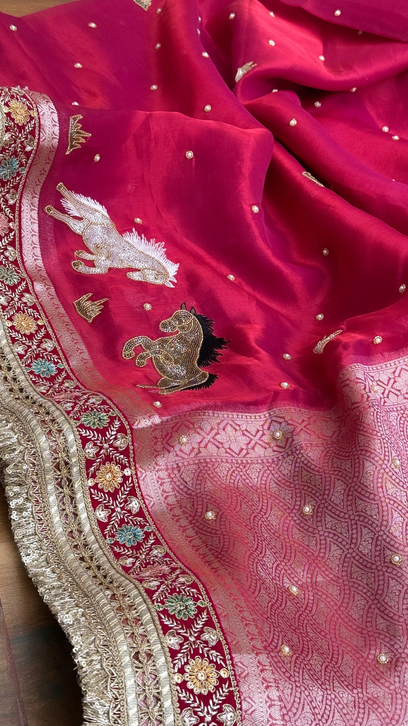 Horse hand embroidered motif cherry pinkish red dhup chao effect tissue silk banarasi gotapatti kadhwa saree