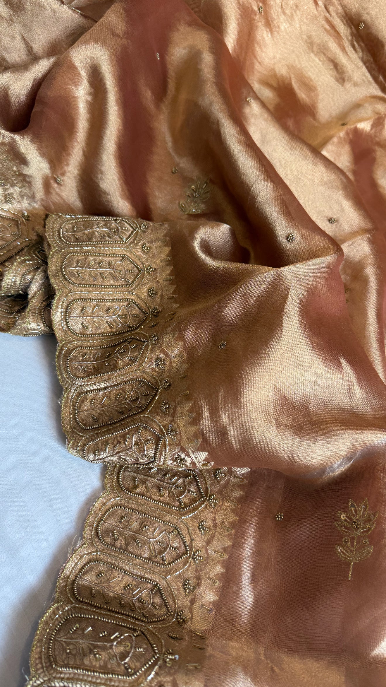 Husn kanjivaram peach tissue silk heavy hand embroidered saree