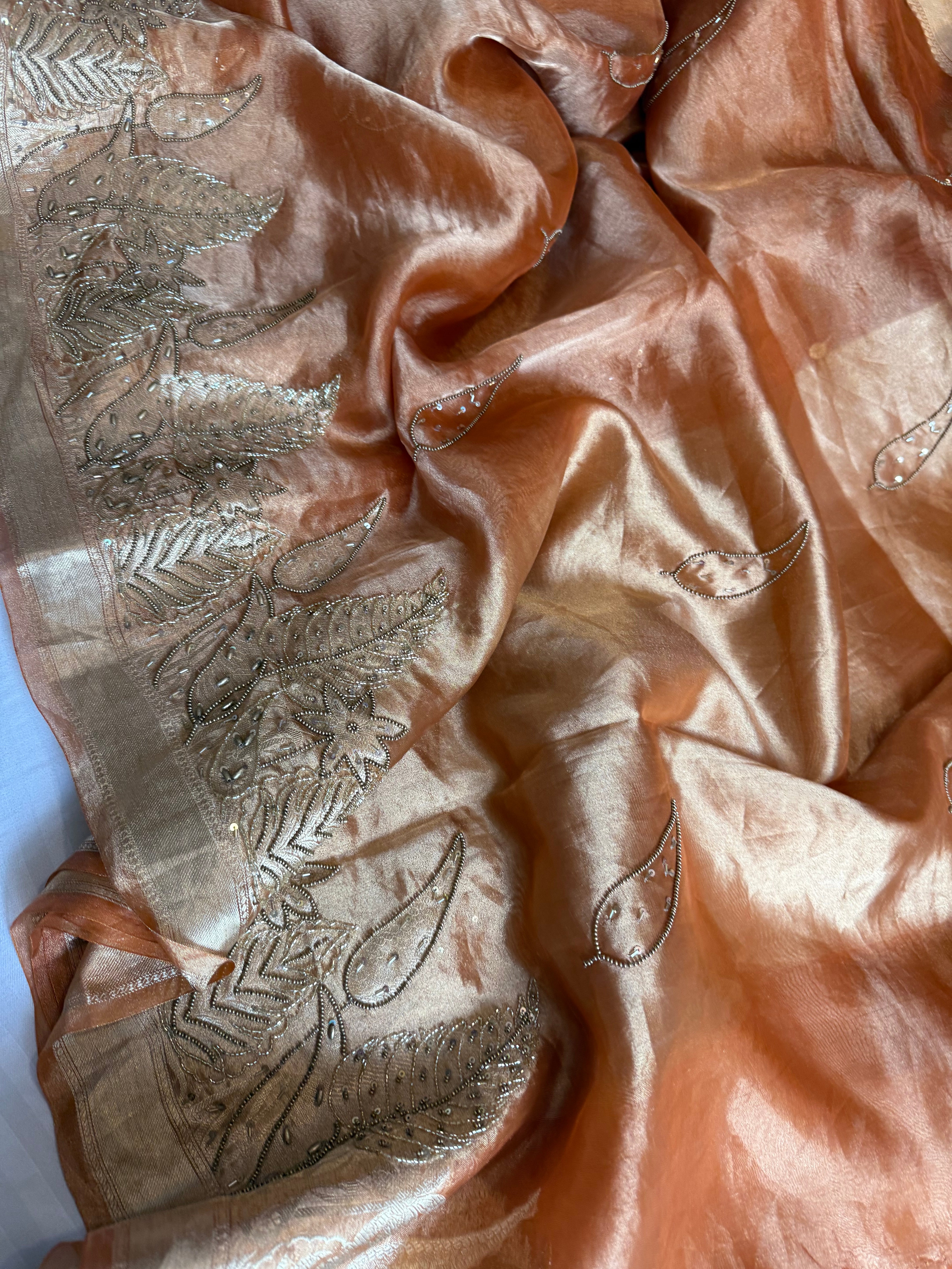 Husn tangerine red tissue silk heavy hand embroidered saree