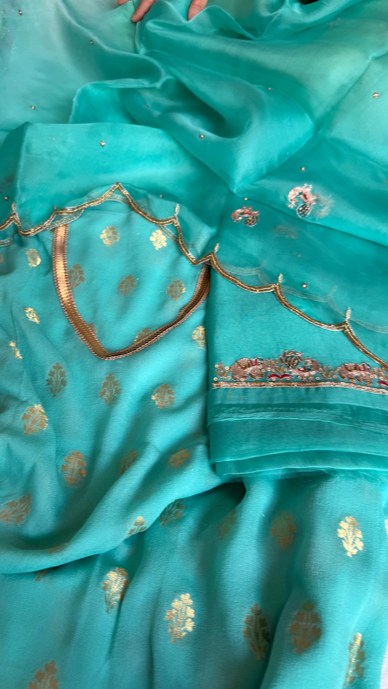 Rama blue banarasi gorgette kadhwa buti kurta paired with toy hathi motif hand embroidered scalloped duppata