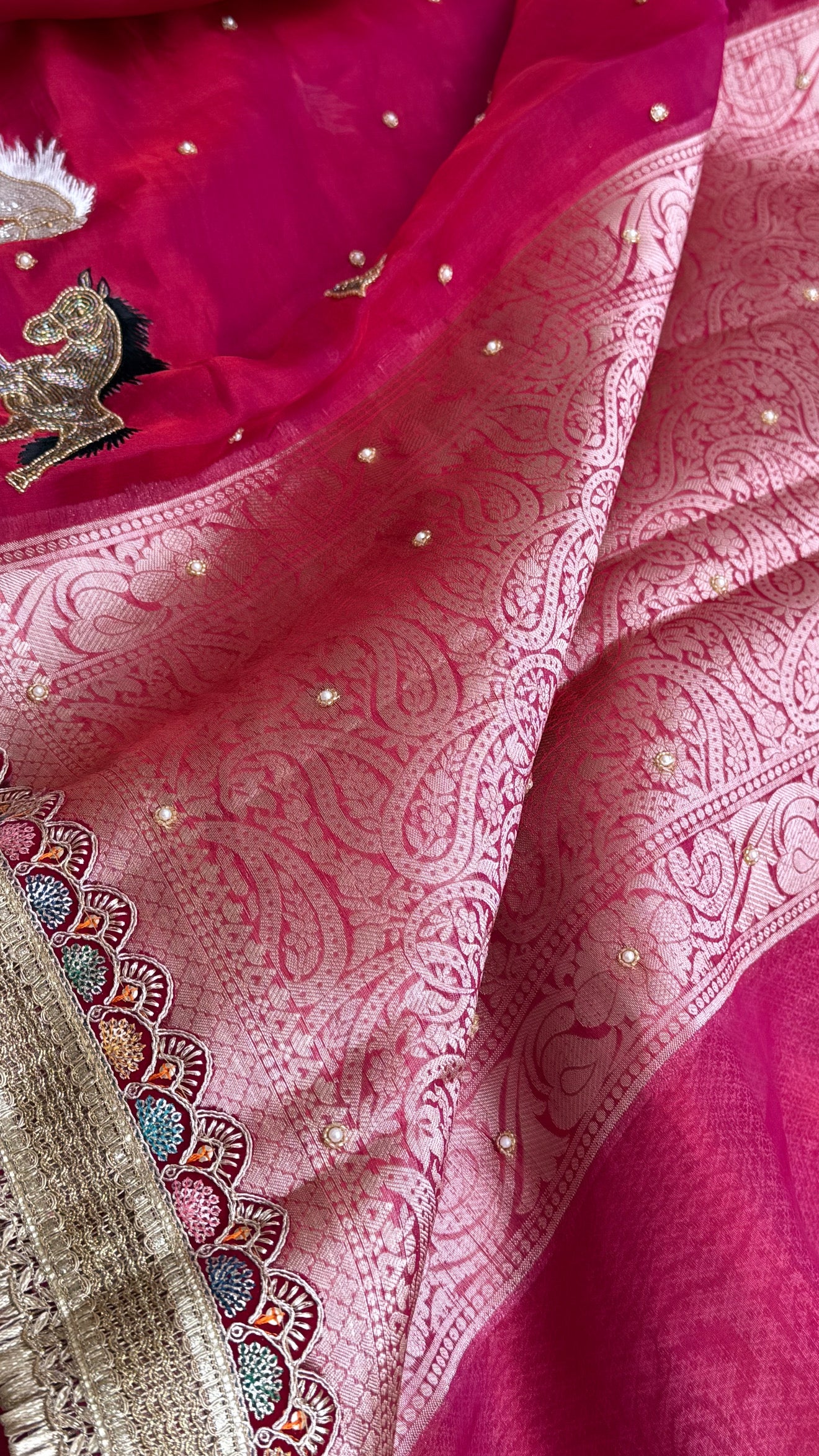 Horse hand embroidered motif cherry pinkish red dhup chao effect tissue silk banarasi gotapatti kadhwa saree
