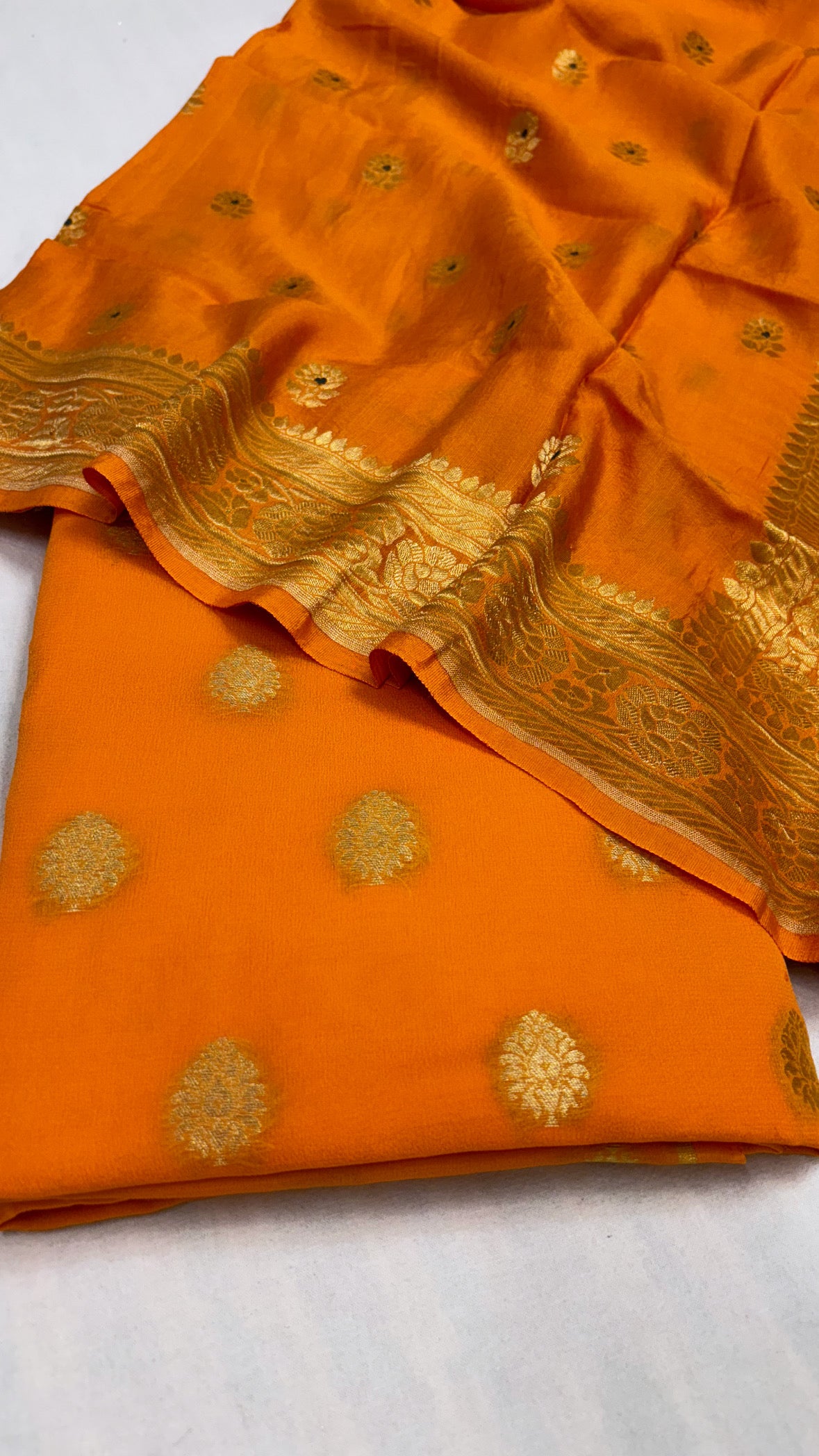 Bright mango gorgette kurta paired with moonga silk kadhwa duppata suit set