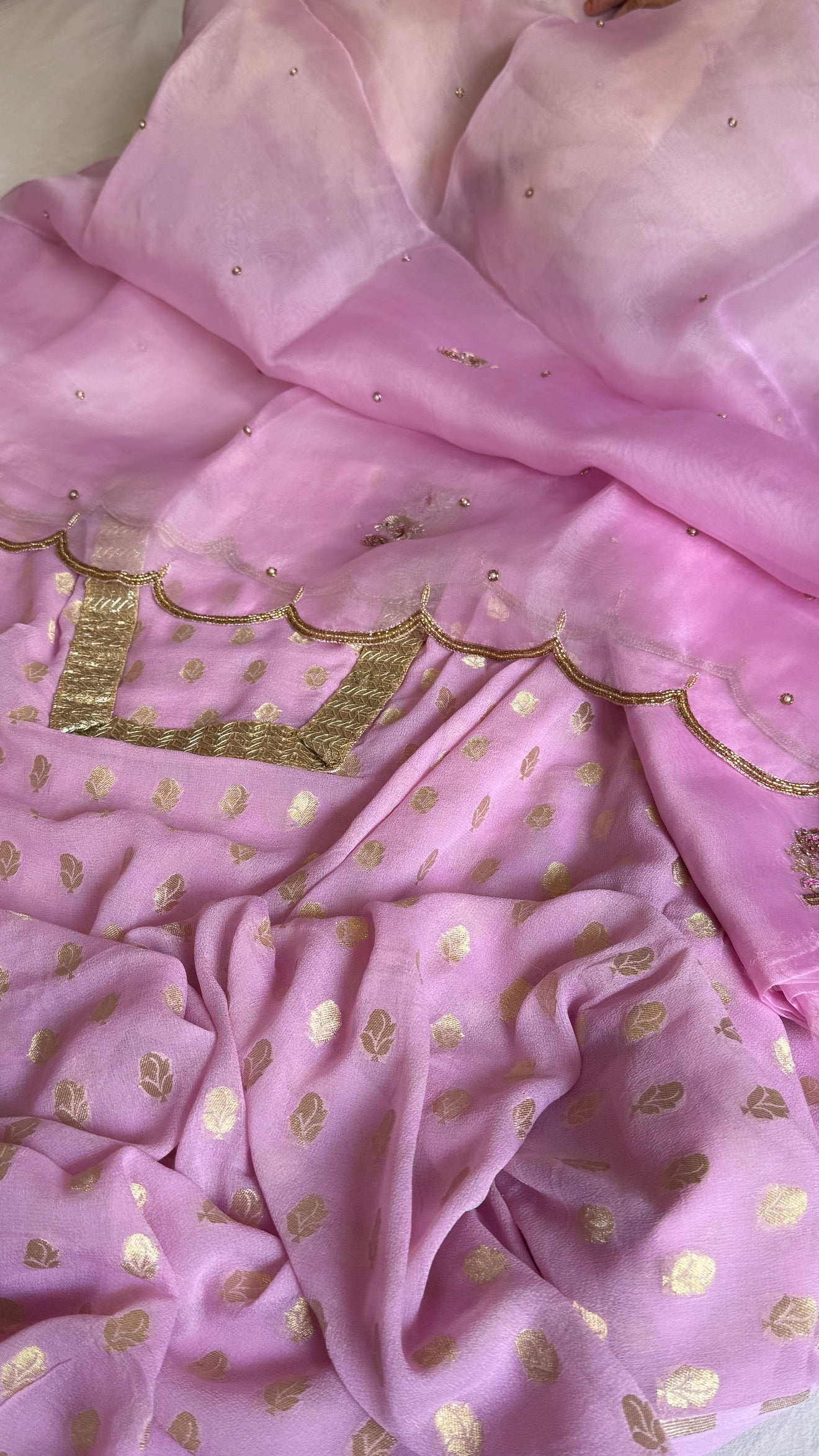 Blush pink banarasi gorgette kadhwa buti kurta paired with toy hathi motif hand embroidered scalloped kora duppata