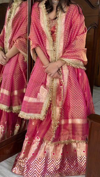 “Kali wala lahenga” — Rani pink semi stitched banarasi tissue silk lehenga set