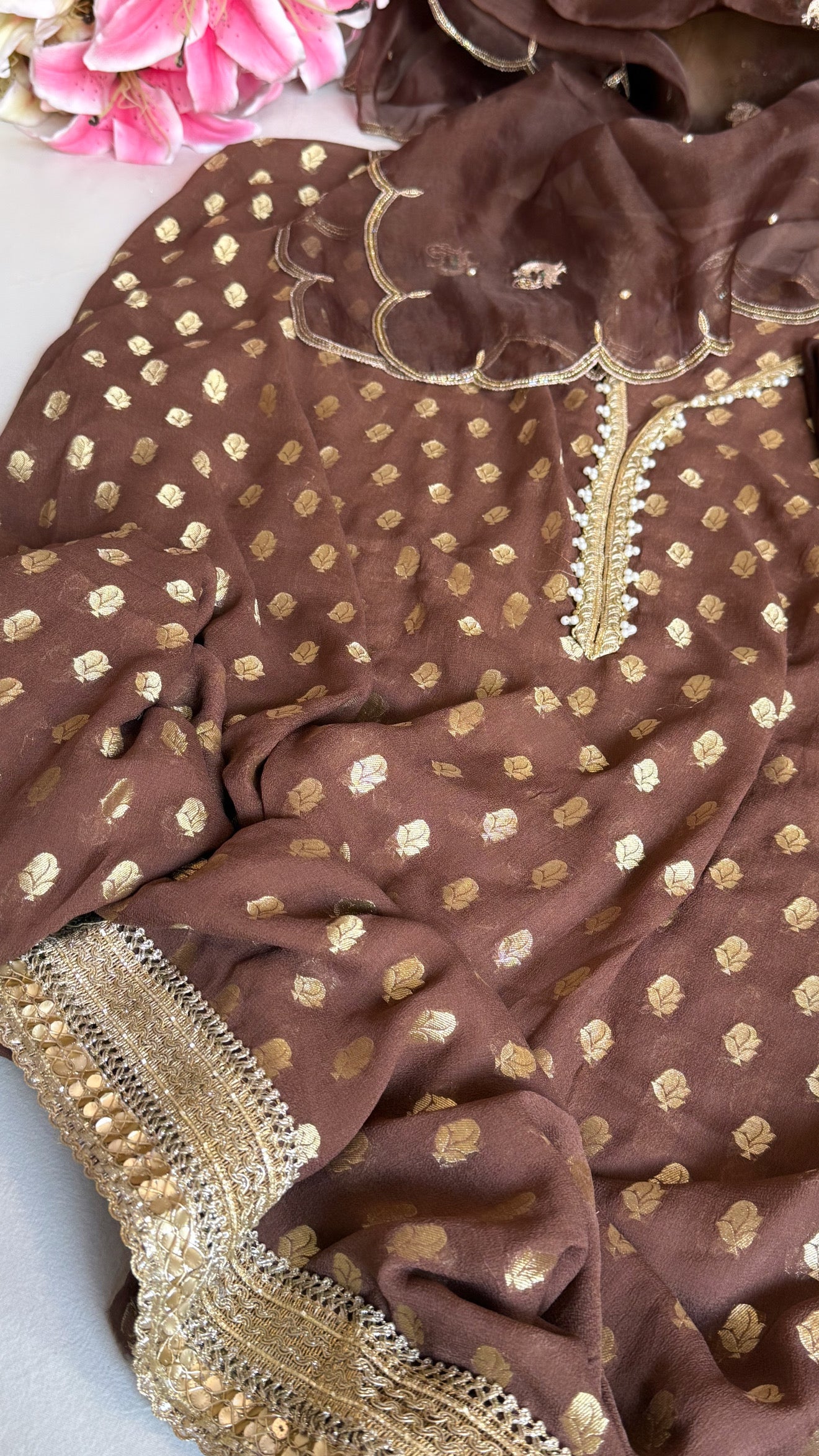 Choco brown banarasi gorgette kadhwa buti kurta paired with toy hathi motif hand embroidered scalloped kora duppata