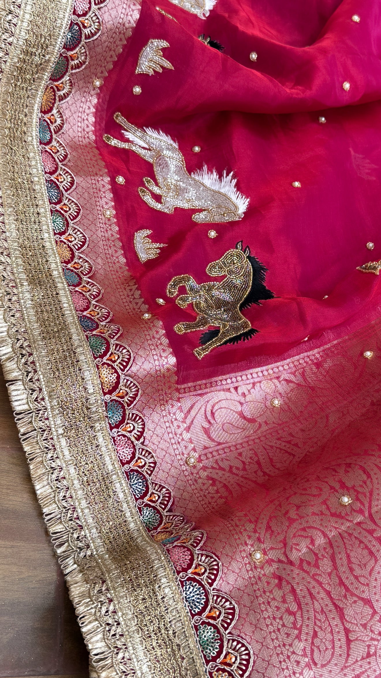 Horse hand embroidered motif cherry pinkish red dhup chao effect tissue silk banarasi gotapatti kadhwa saree