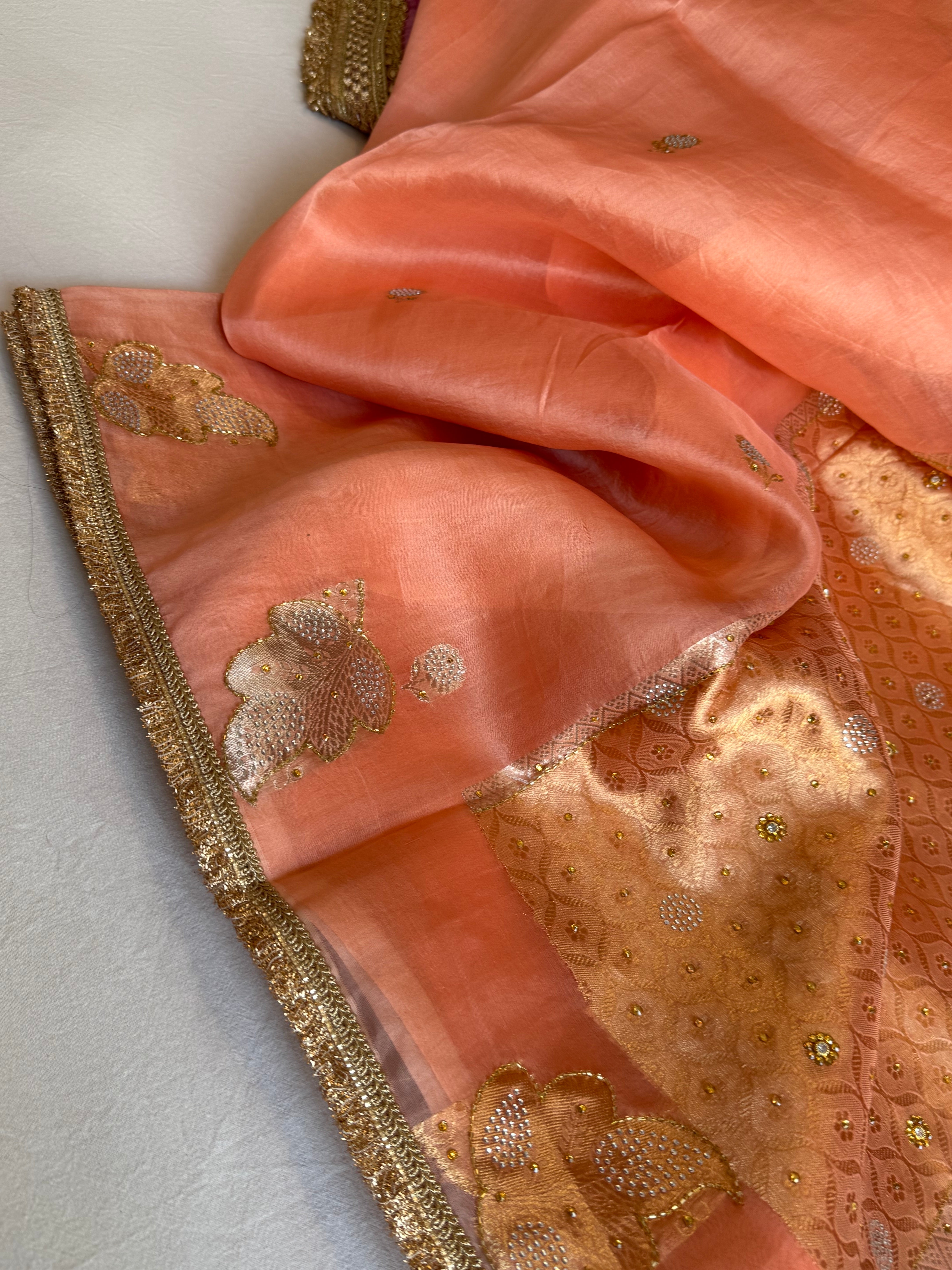 Creamy peach banarasi kora silk heavy sitara stonework kadhwa buti hand embroidered gotapatti saree