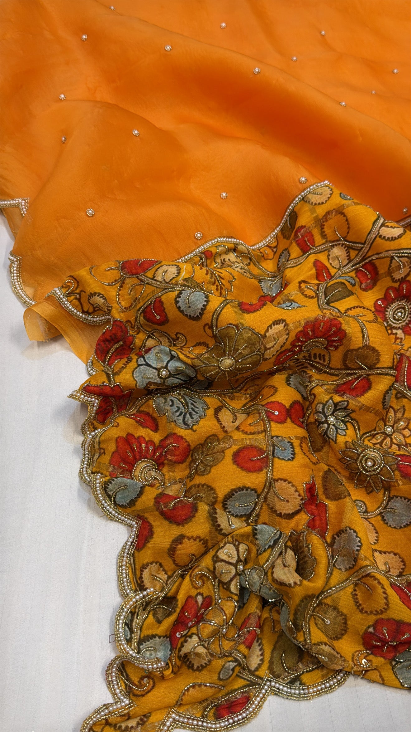 Turmeric yellow kora silk patched printed pallu kadhwa scalloped saree