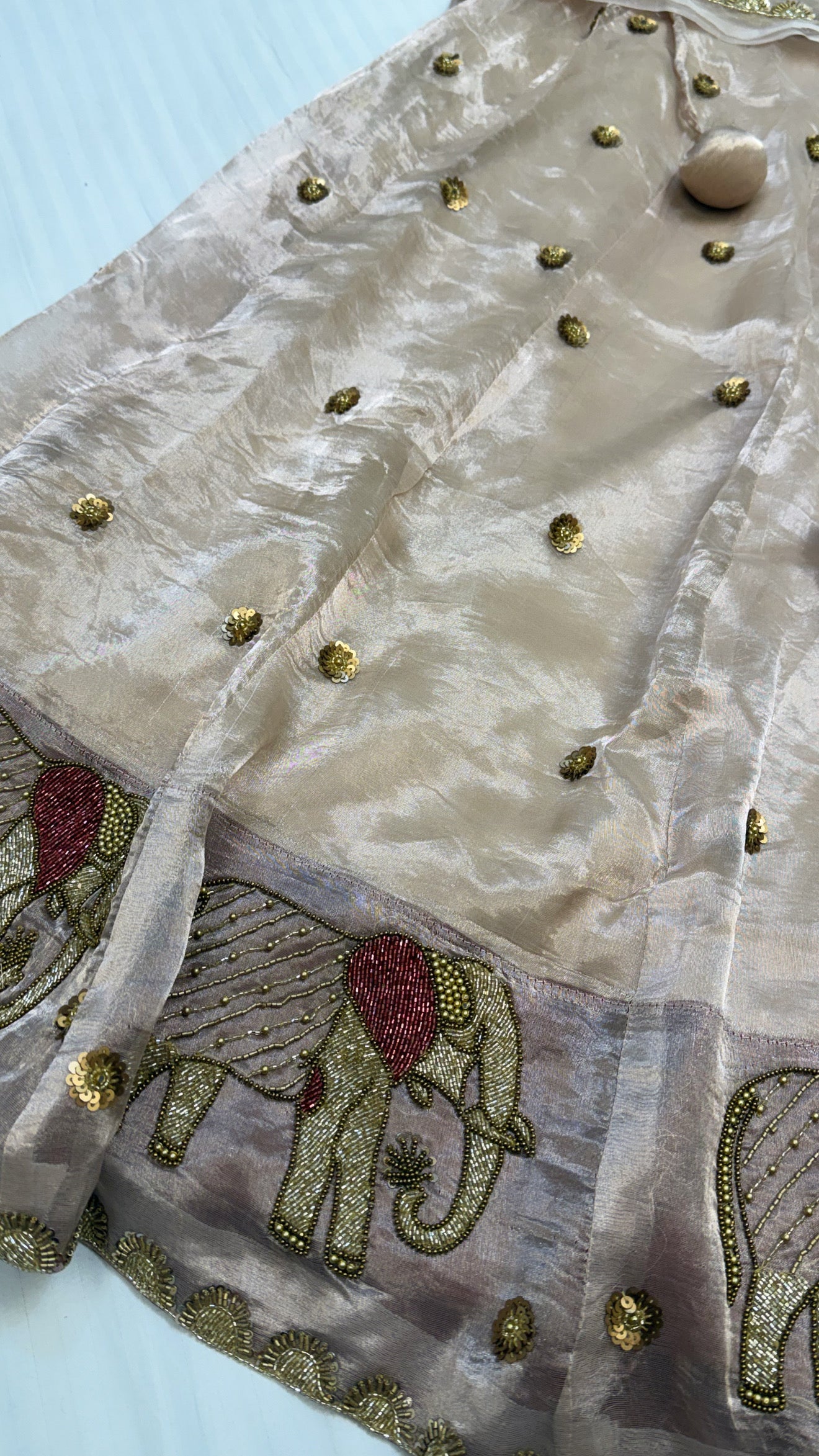 Gajgamini diamond tissue silk light rose gold zari elephant motif hand embroidered lehenga sets