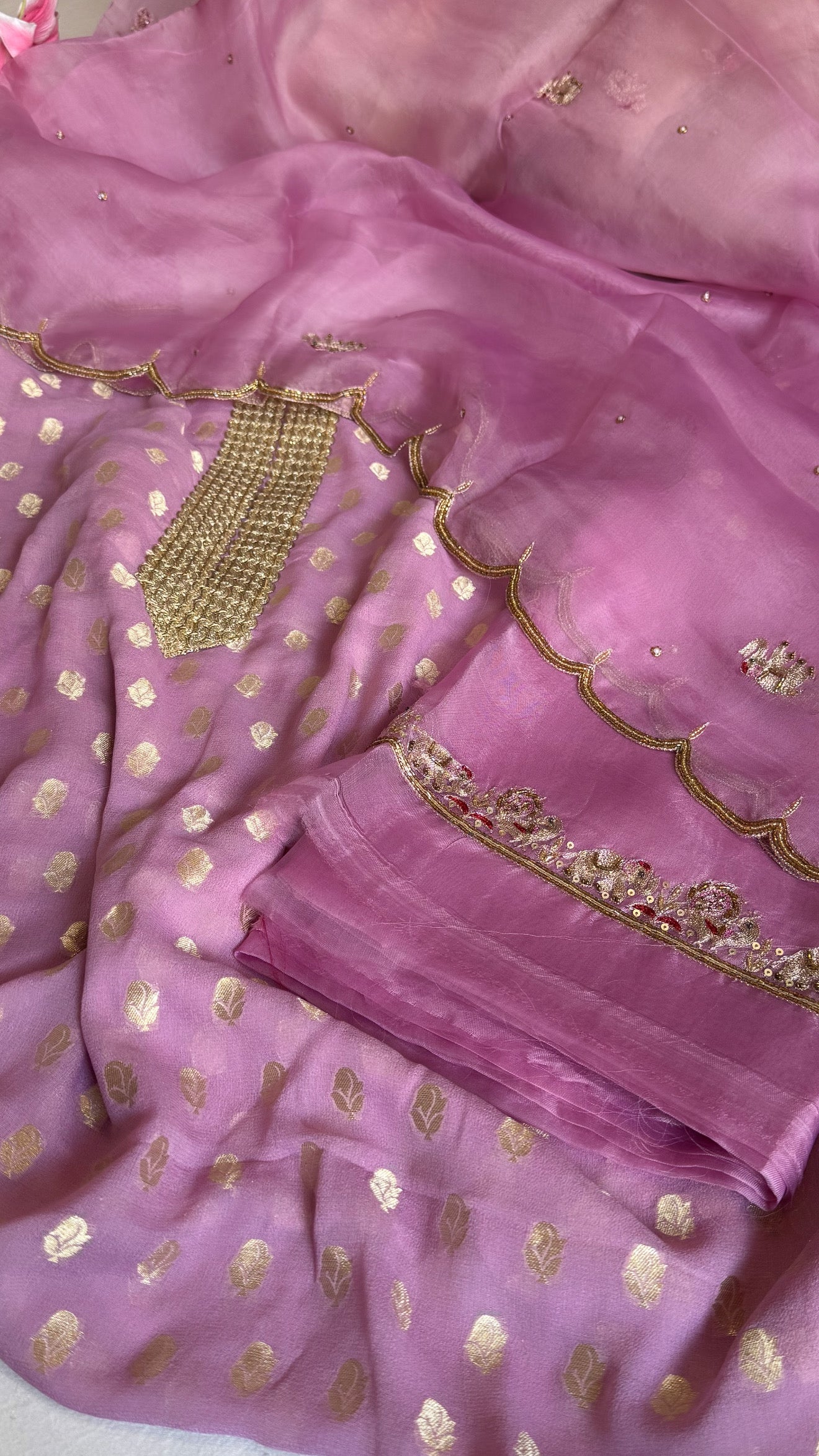Dusty pink banarasi gorgette kadhwa buti kurta paired with toy hathi motif hand embroidered scalloped kora duppata