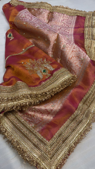 Husn pinkish-orange dhup chao effect tissue silk hand embroidered saree