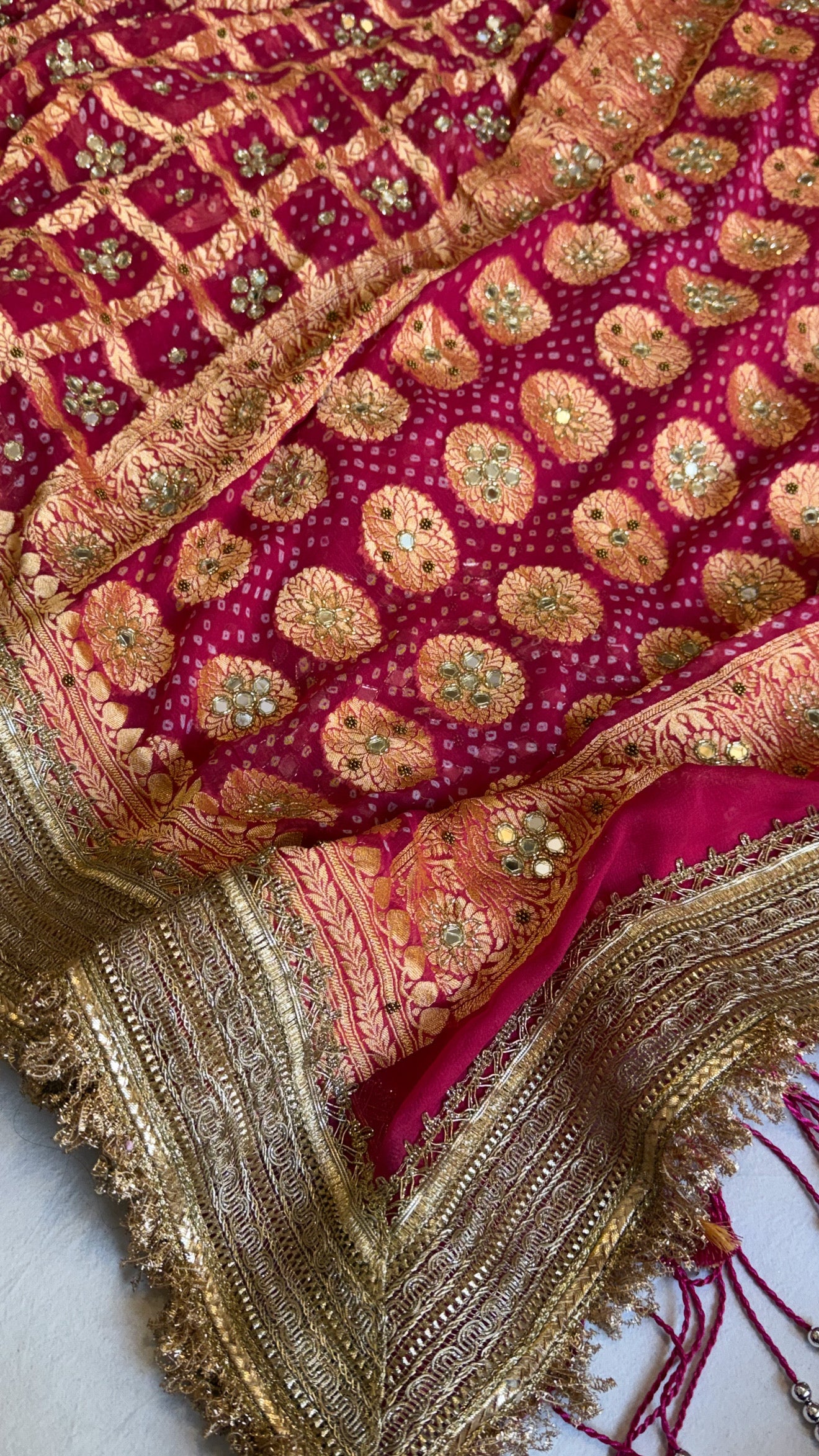 Cherry pink rai bandhej mirror work banarasi gorgette saree with long latkans