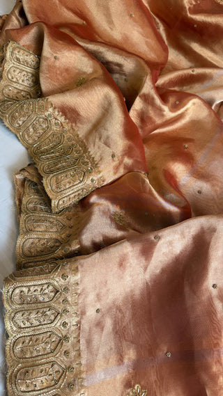 Husn reddish orange tissue silk heavy hand embroidered saree