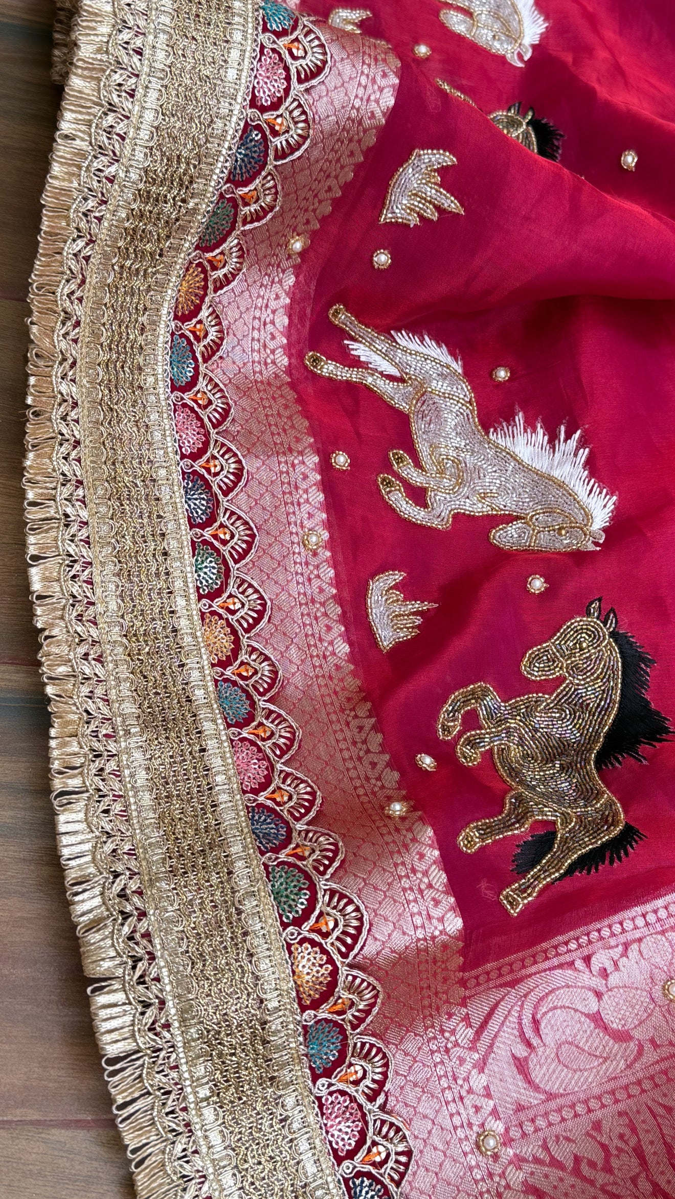 Horse hand embroidered motif cherry pinkish red dhup chao effect tissue silk banarasi gotapatti kadhwa saree