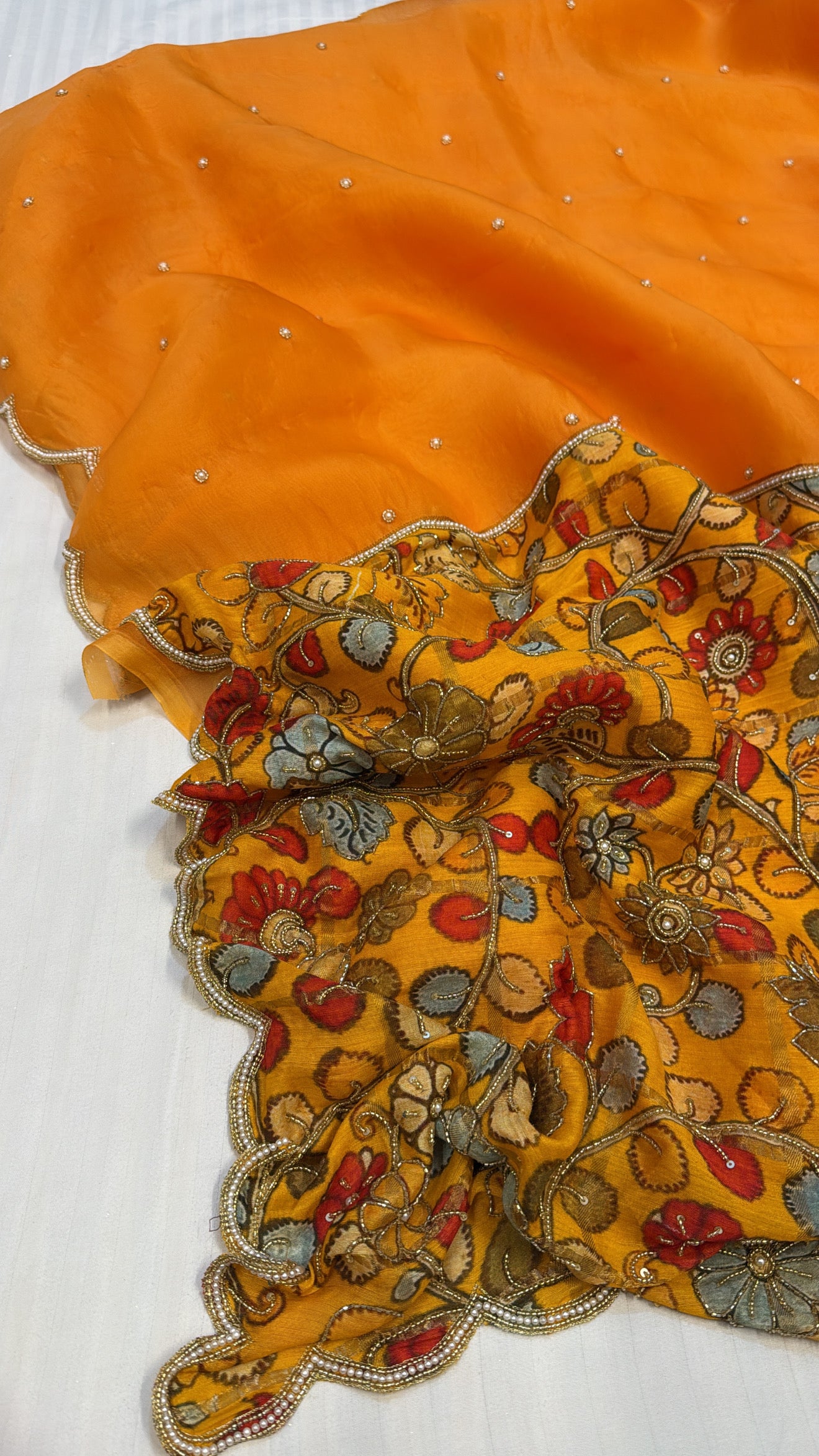 Turmeric yellow kora silk patched printed pallu kadhwa scalloped saree