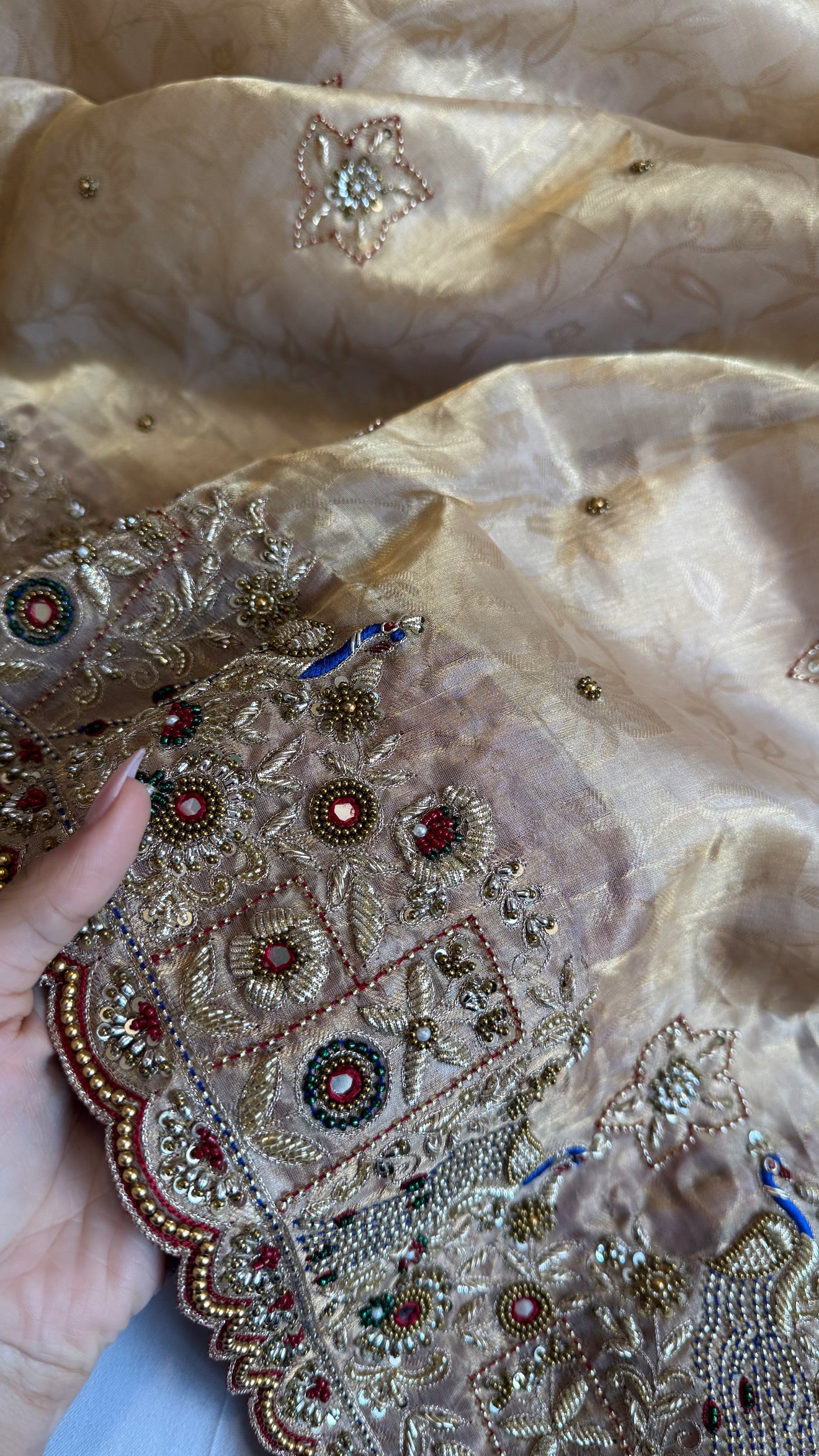 Jadau molten gold tissue silk hand embroidered peacock motif saree