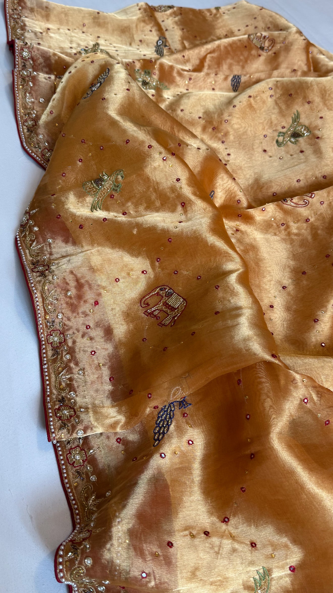 Shikarbagh edit spicy tangerine orange diamond tissue silk hand embroidered kadhwa saree