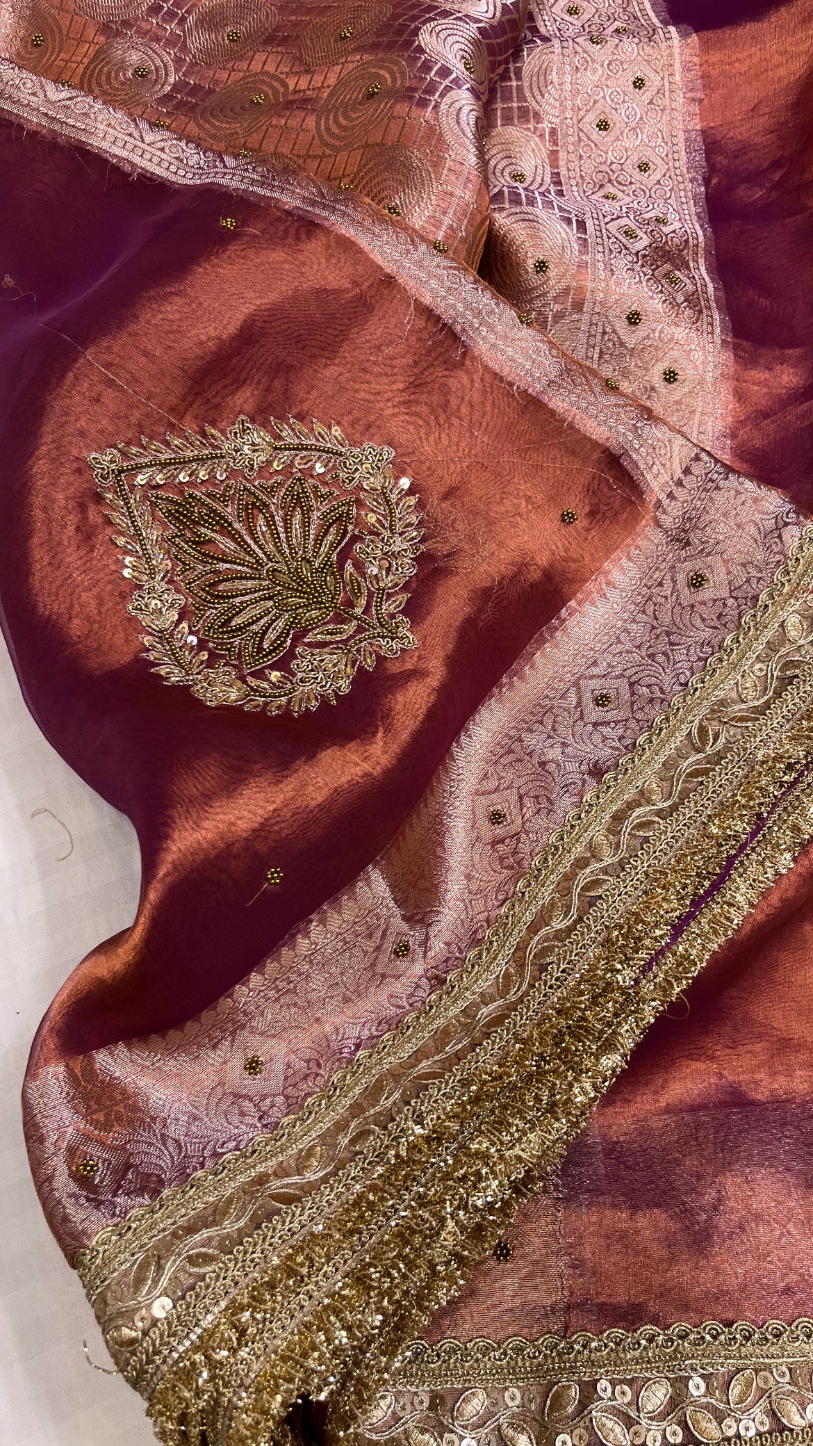 Husn copperish purple tissue silk hand embroidered saree