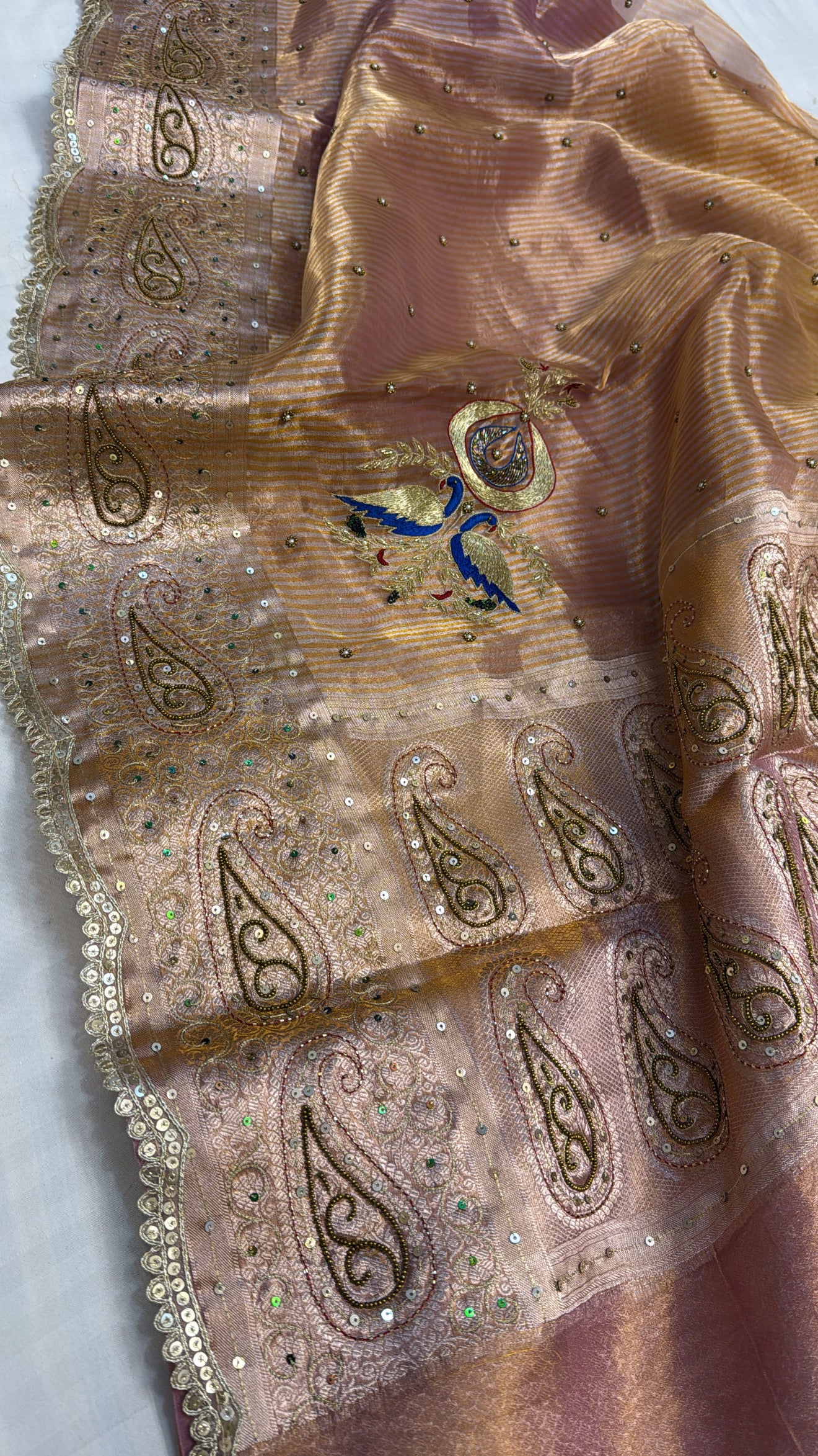 Peachish-pink ombre shaded tissue silk hand embroidered saree