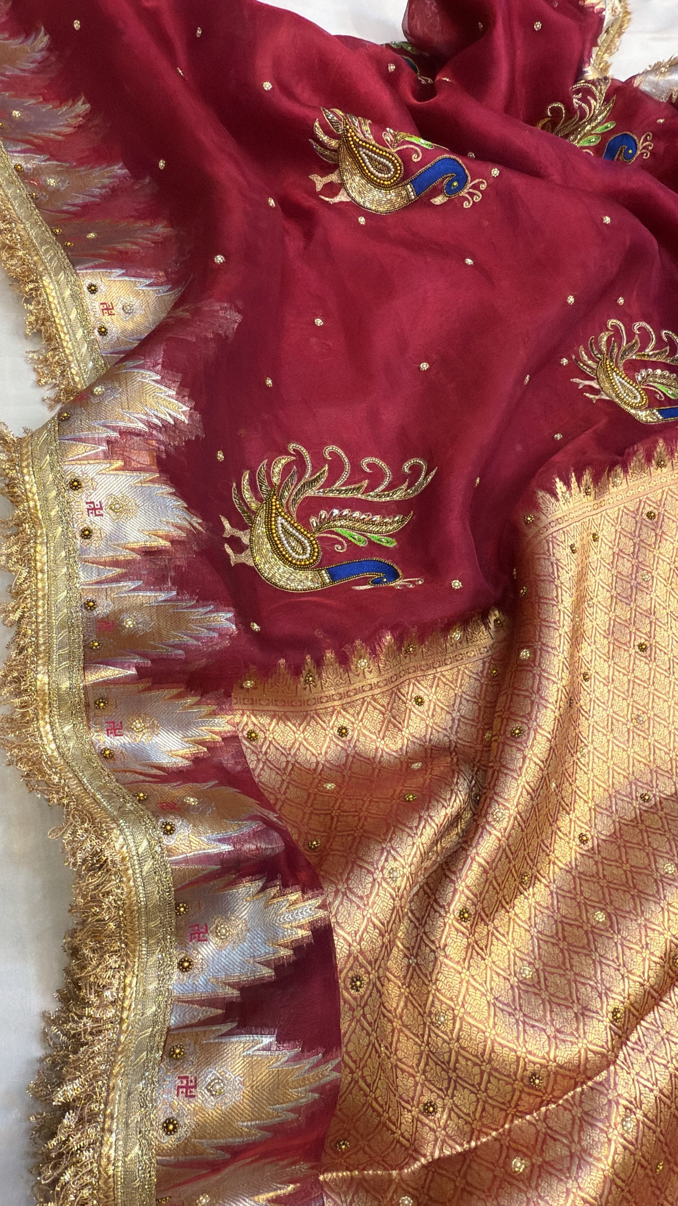 Cranberry red tissue silk kadhwa hand embroidered saree