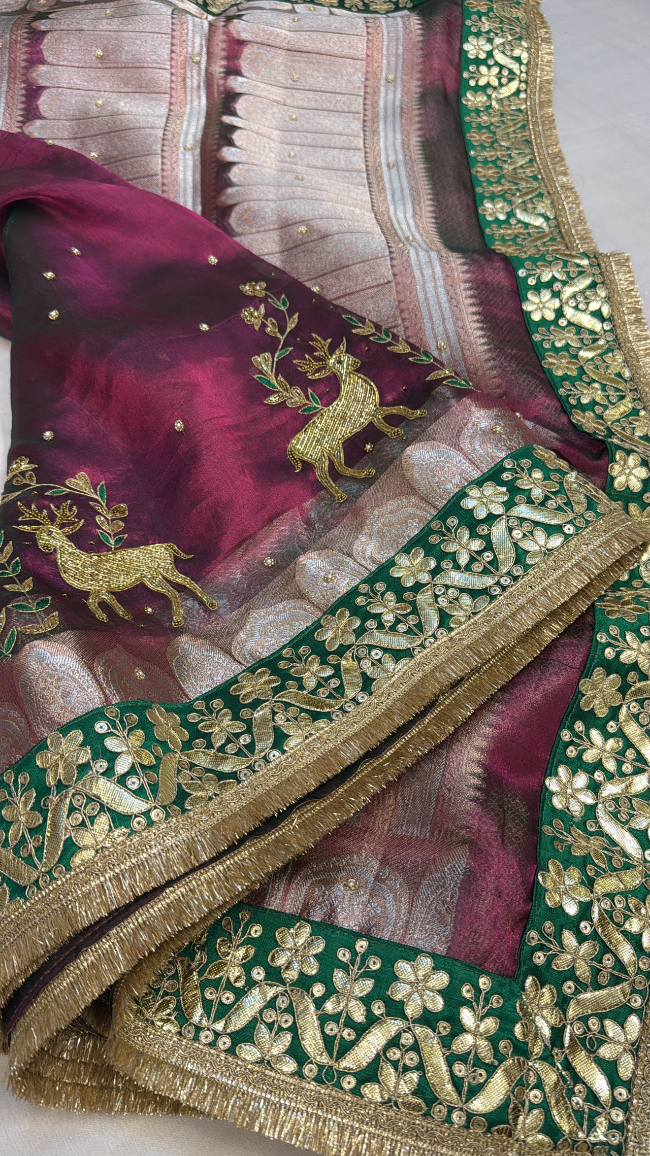 Husn cranberry pink tissue silk deer motif hand embroidered saree