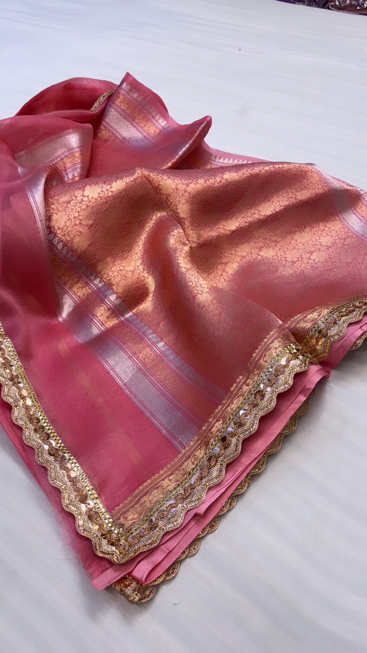 Onion peach shade leela kora silk kadhwa buti saree