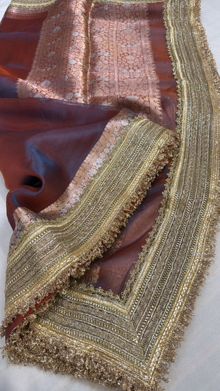 Maharani metallic maroonish-blue dhup chao effect tissue silk saree
