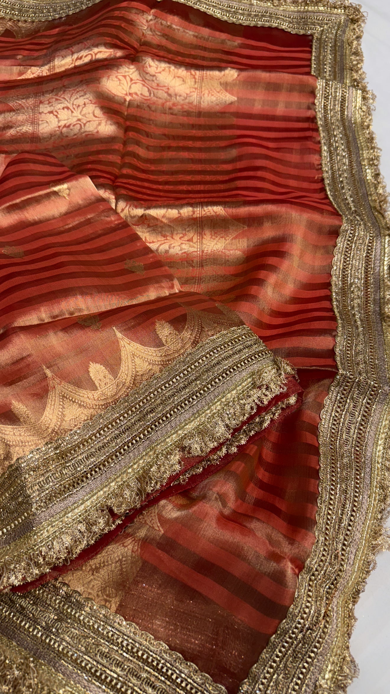 Maharani rust red tissue silk striped kadhwa saree