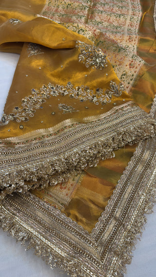 Husn mustard gold tissue silk heavy hand embroidered saree