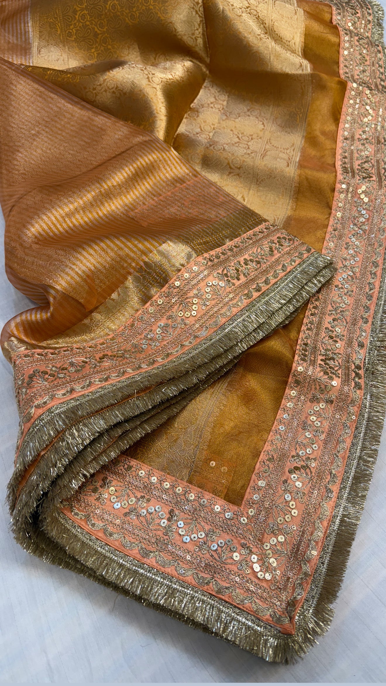 Chuski orange maharani tissue silk striped meenakari border saree