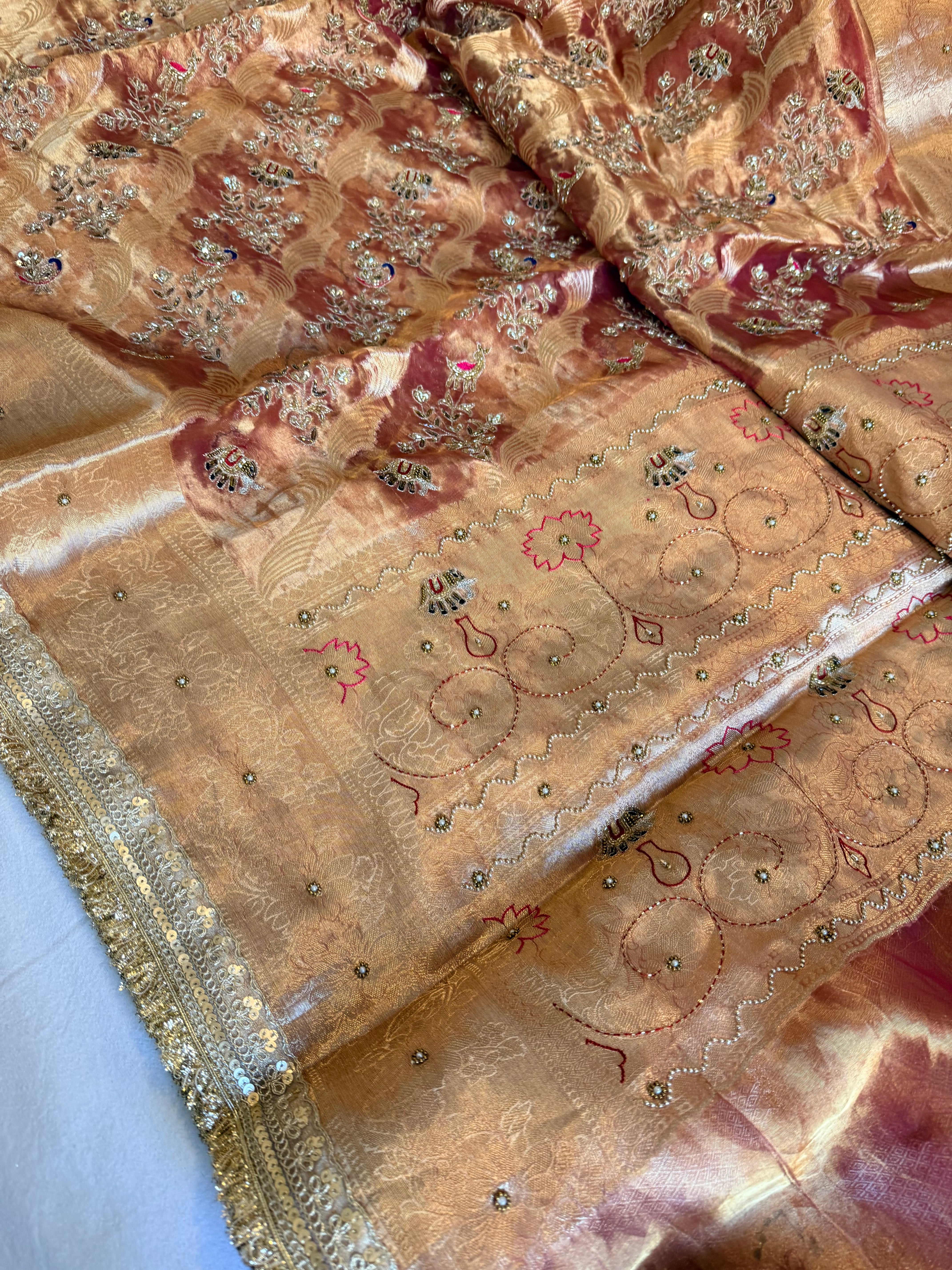 Rustic red tissue silk shikargah motif hand embroidered saree