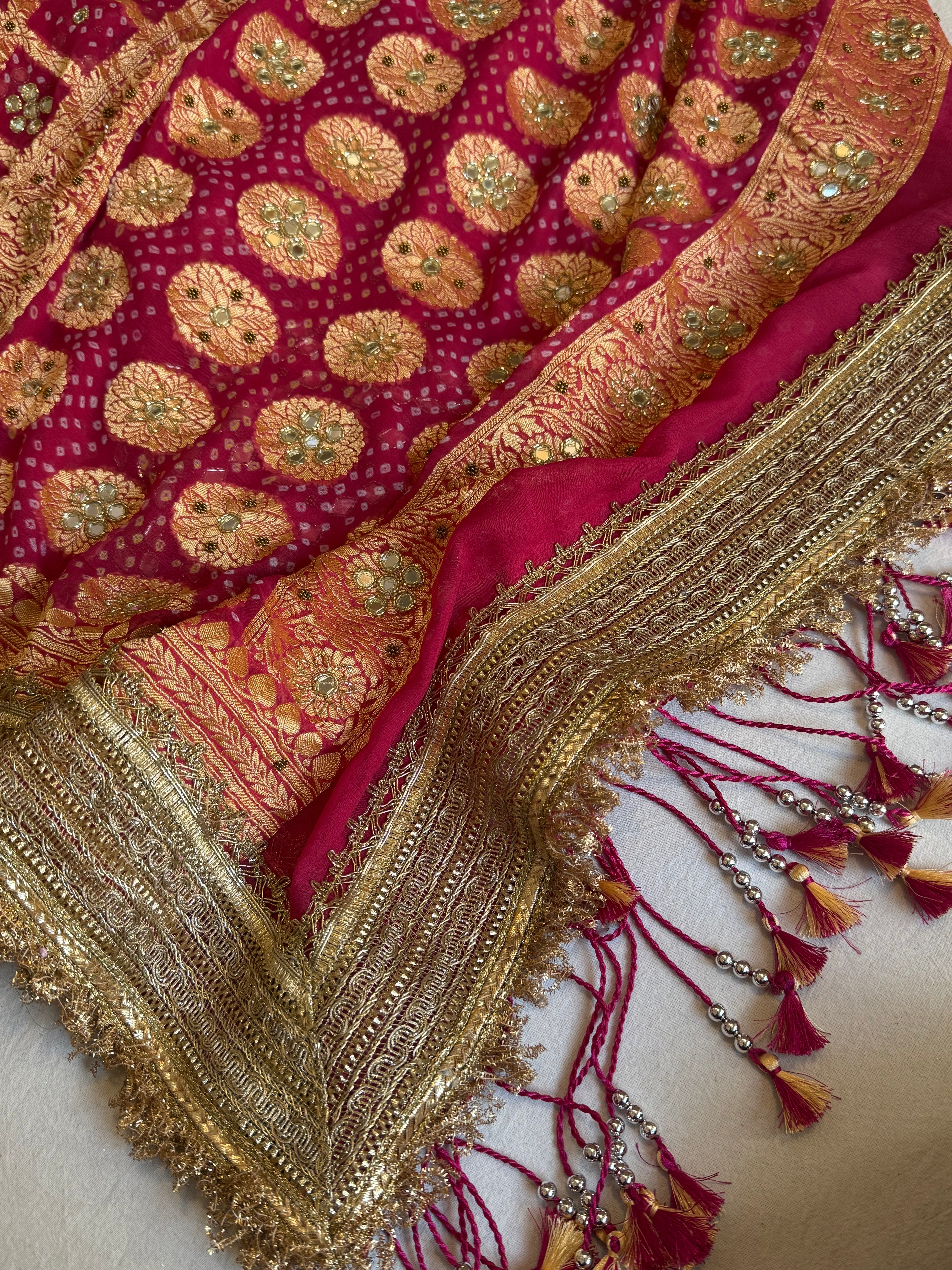 Cherry pink rai bandhej mirror work banarasi gorgette saree with long latkans