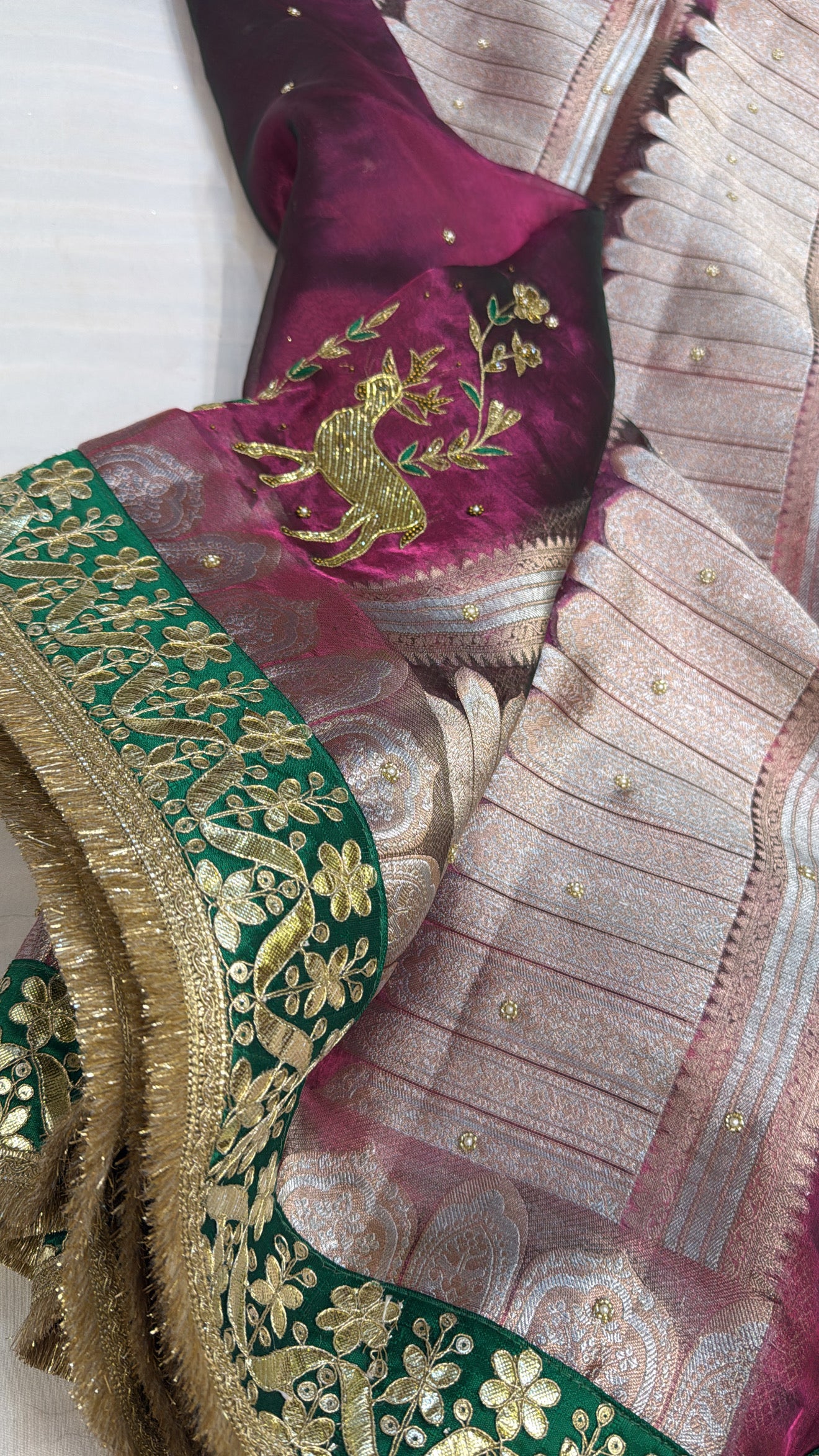 Husn cranberry pink tissue silk deer motif hand embroidered saree