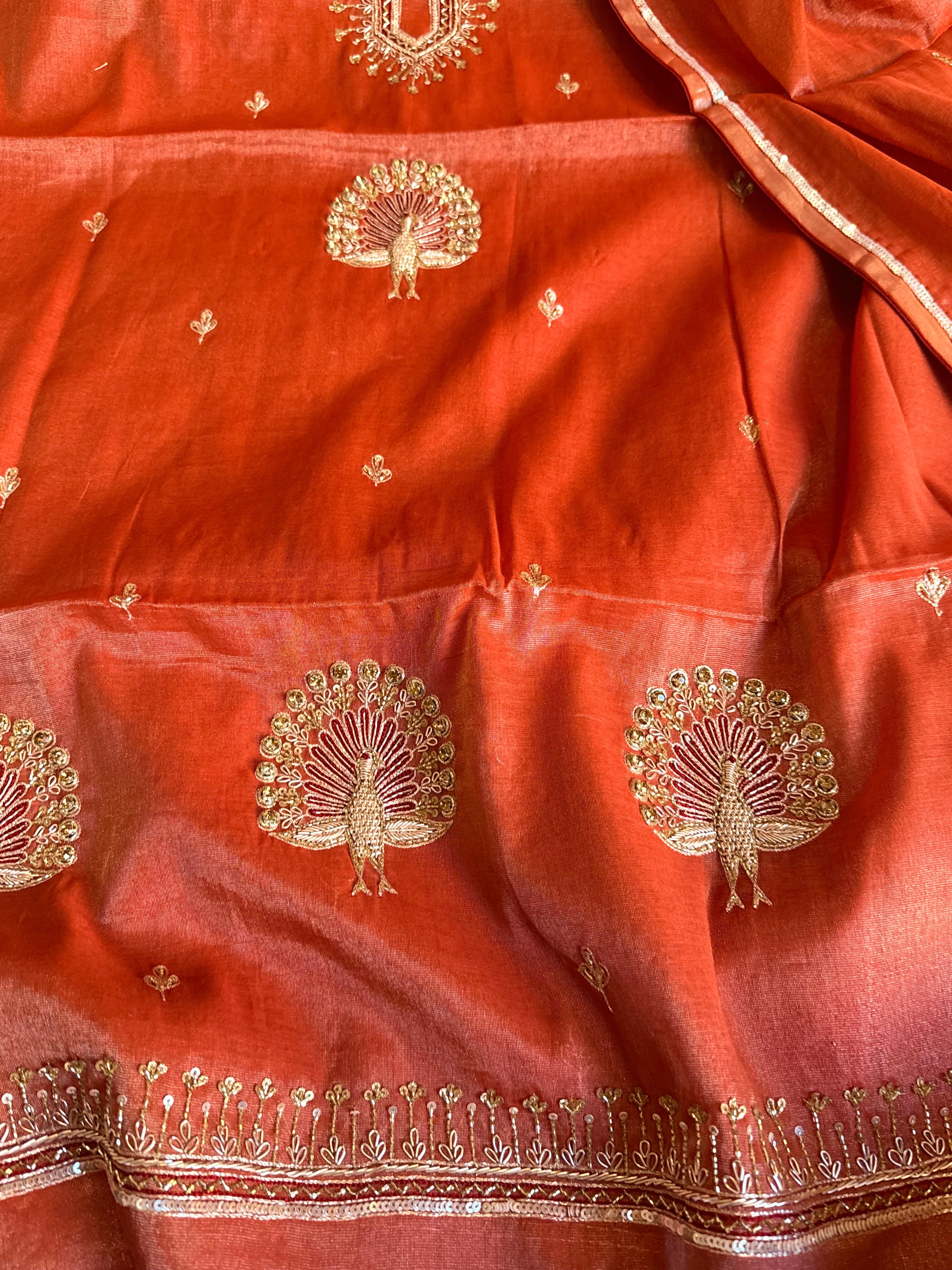 Reddish-orange mul tissue silk hand embroidered kadhwa suit set