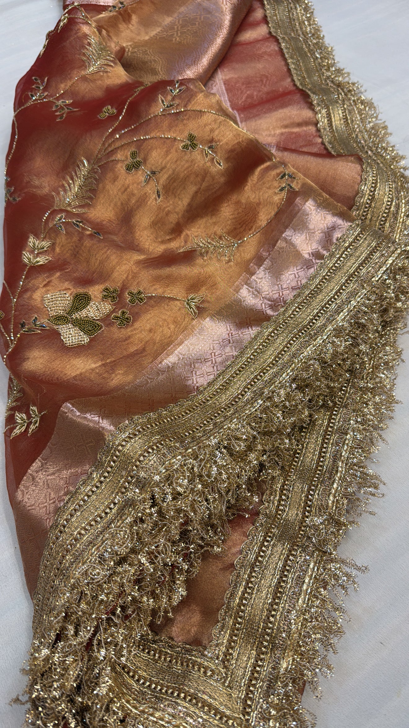 Husn tangerine red tissue silk hand embroidered saree