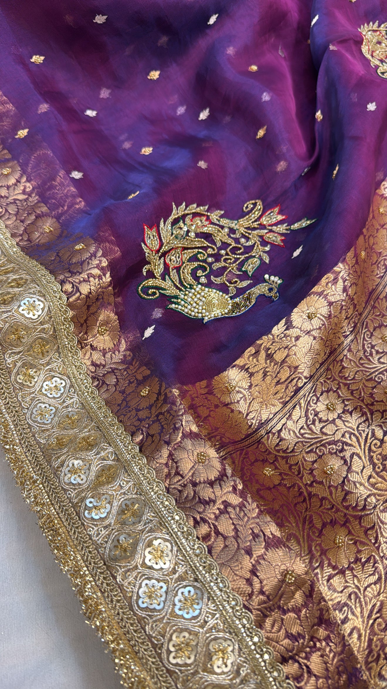 Husn peacock blue-purple dhup chao effect tissue silk hand embroidered saree