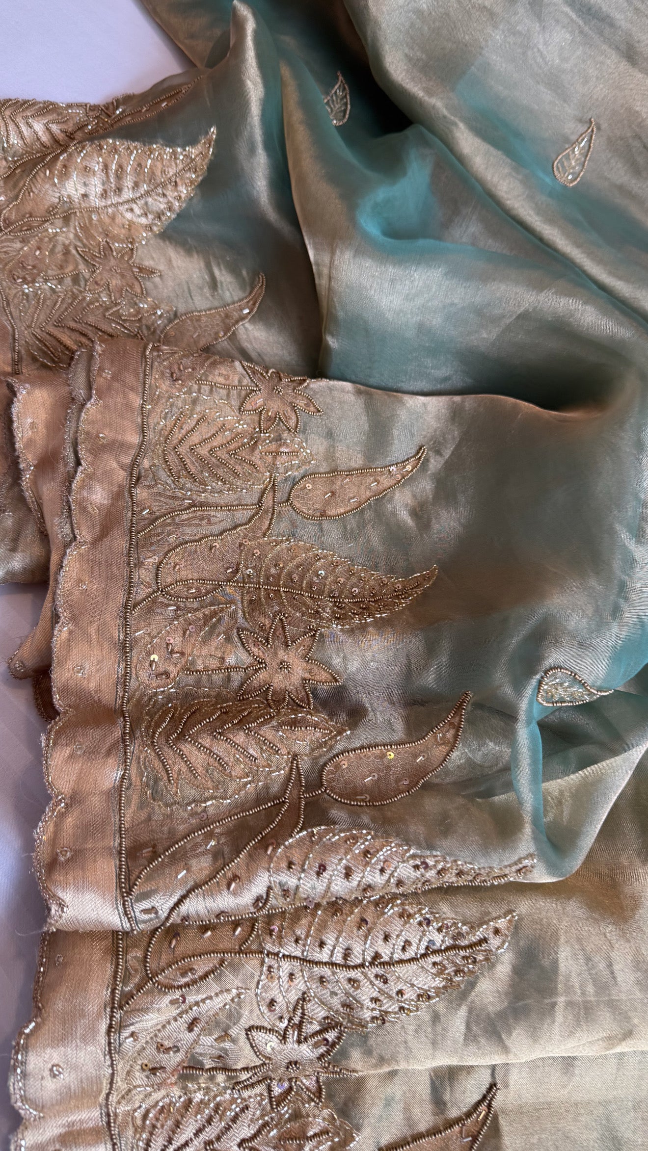 Husn candy green tissue silk heavy hand embroidered saree