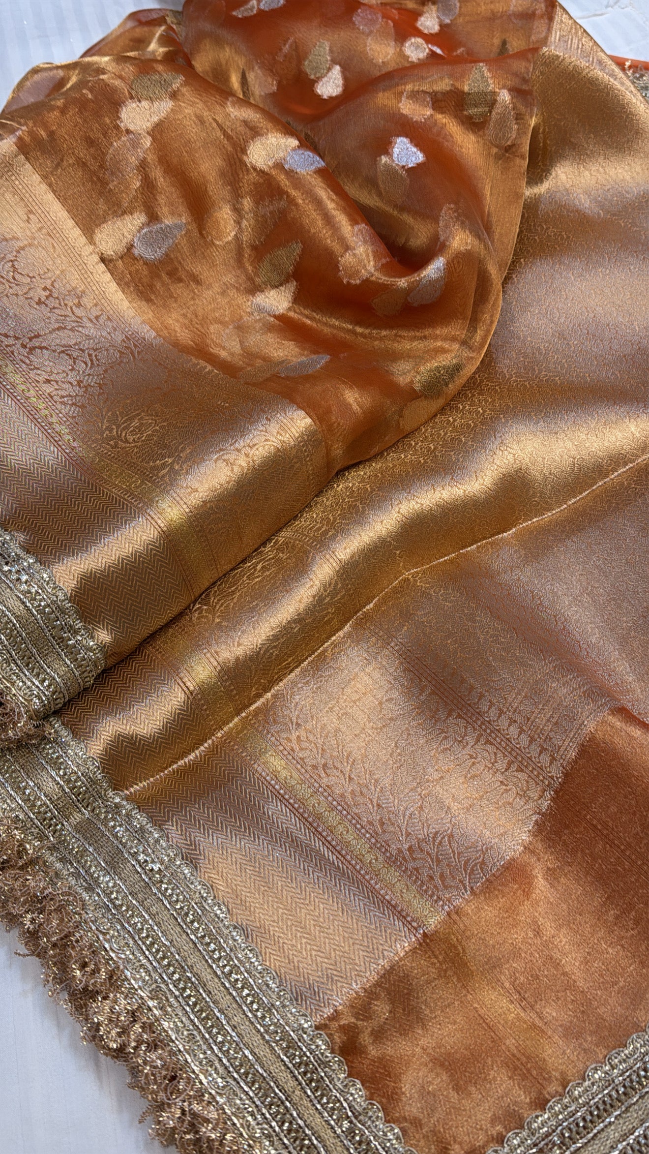 Orangey gold dhup chao effect maharani tissue silk kadhwa buti saree