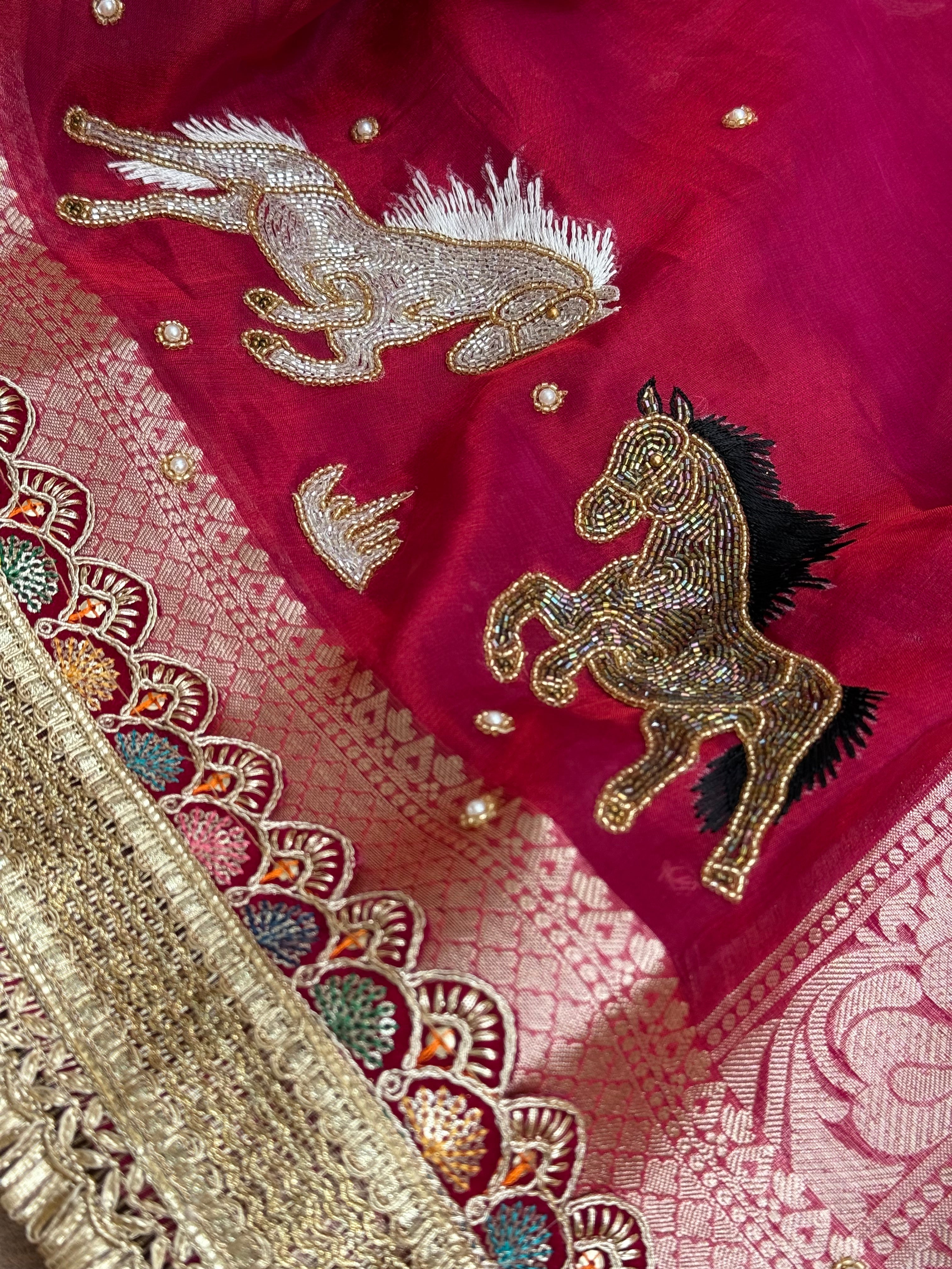 Horse hand embroidered motif cherry pinkish red dhup chao effect tissue silk banarasi gotapatti kadhwa saree