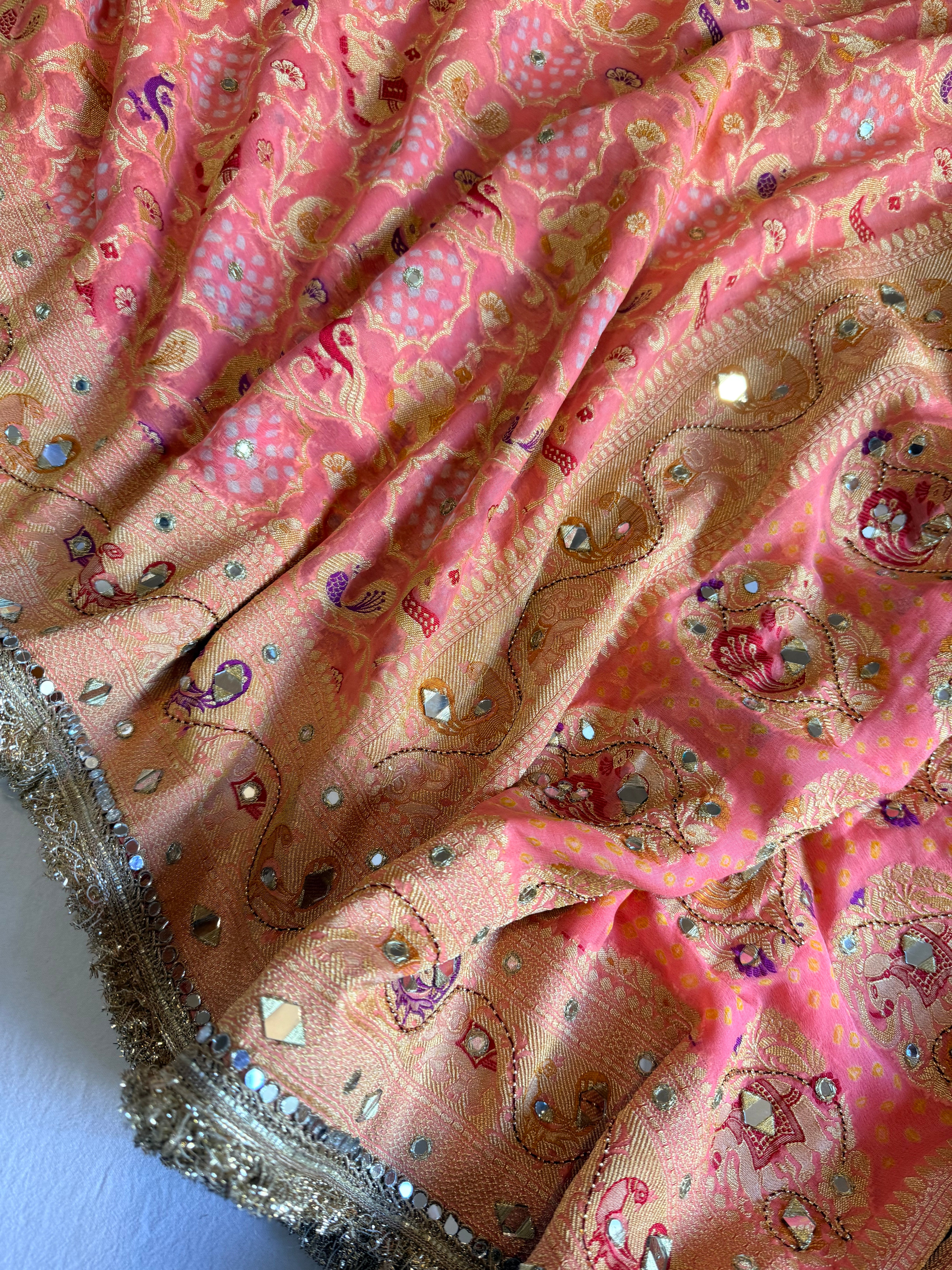 Banarasi blush shades of chiffon rai bandhej mirror work hand embroidered saree