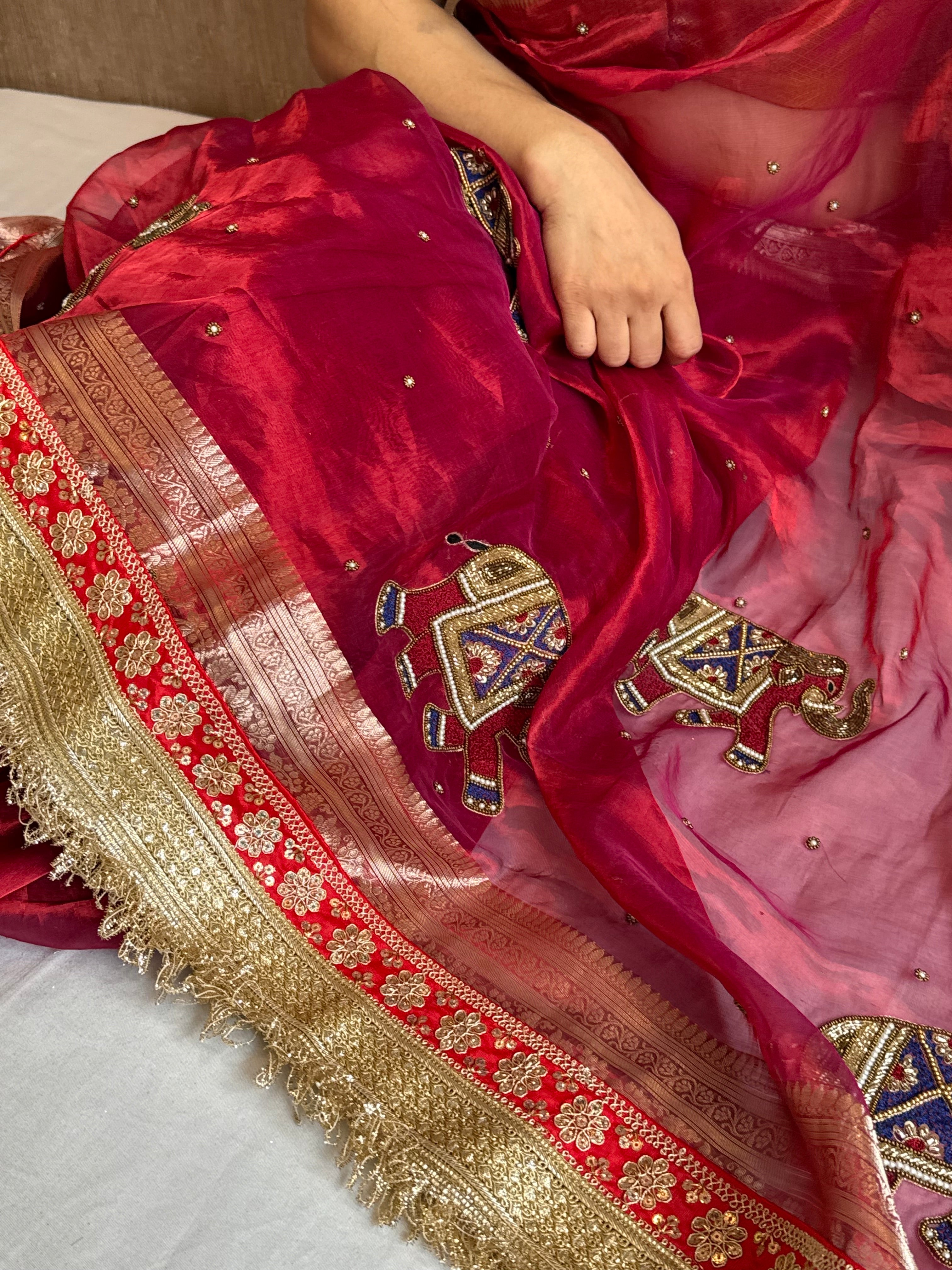 Elephant motif cranberry metallic red husn tissue silk hand embroidered saree