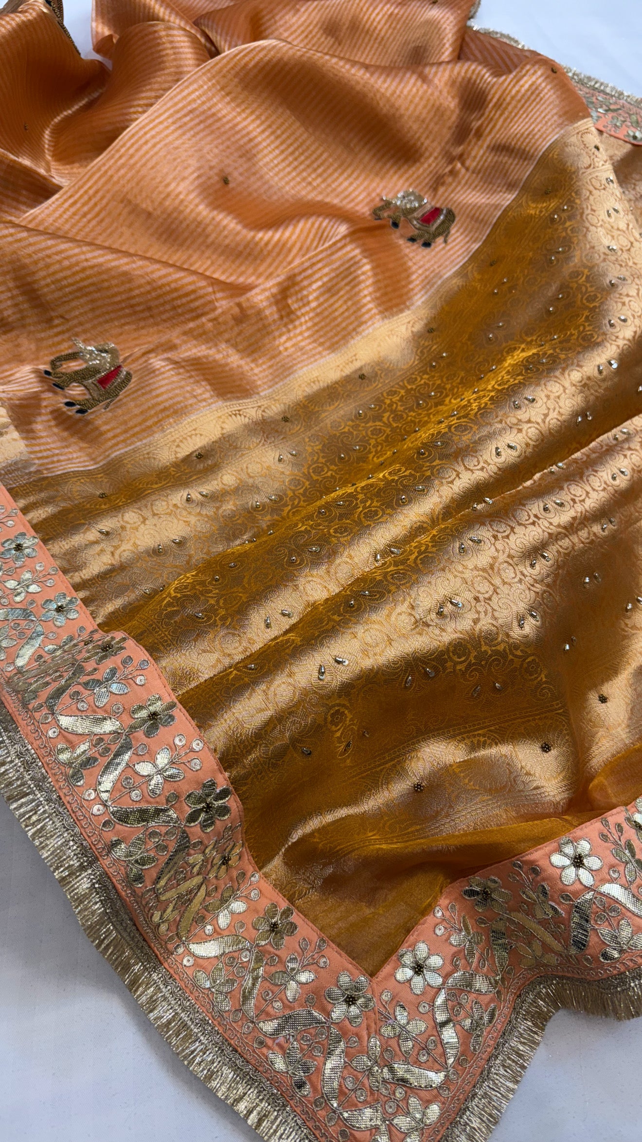 Baarat wali sarees - Chuski orange husn tissue silk elephant motif hand embroidered saree