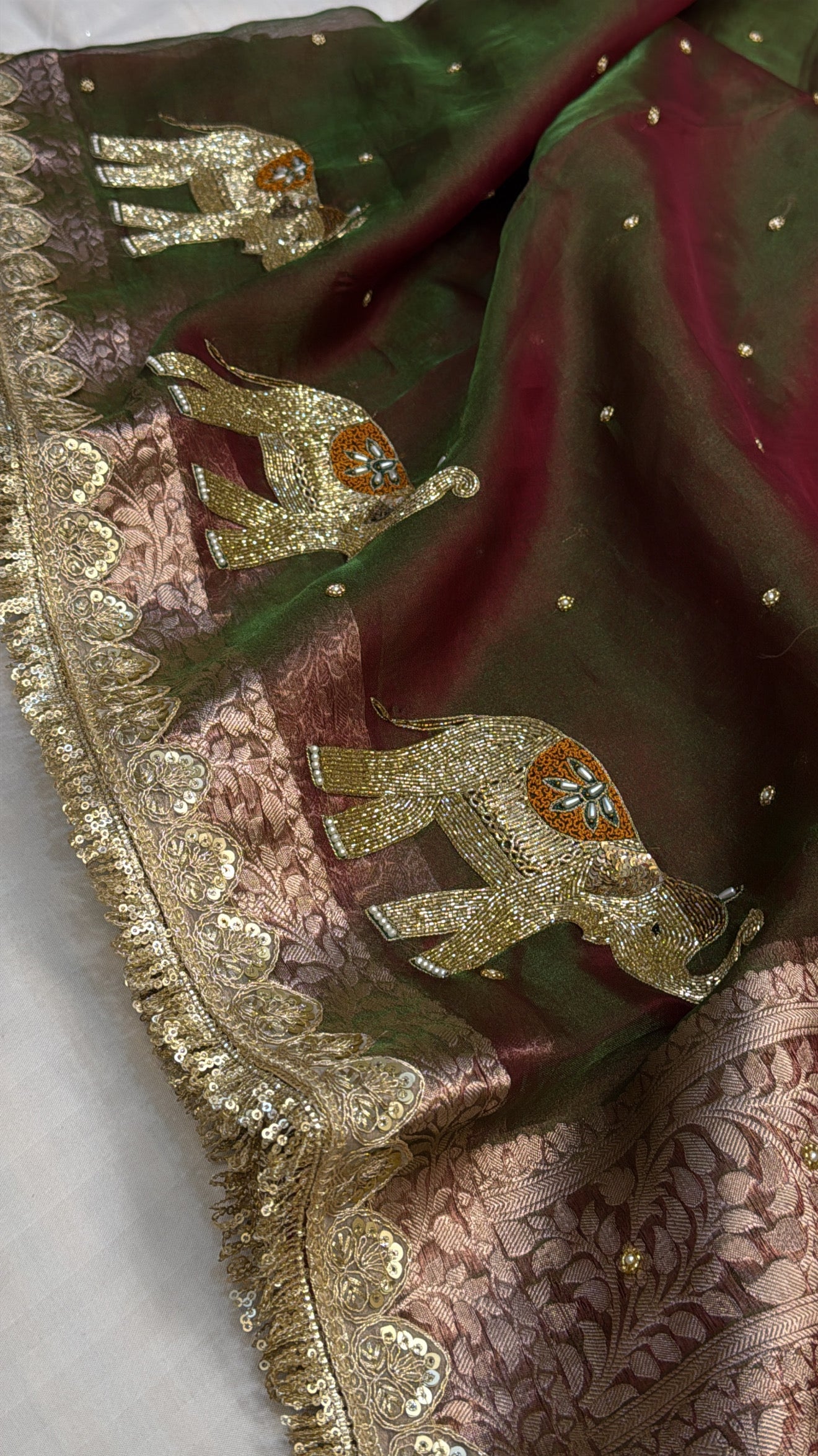 Mehendi green dhup chao effect tissue silk hand embroidered elephant motif saree