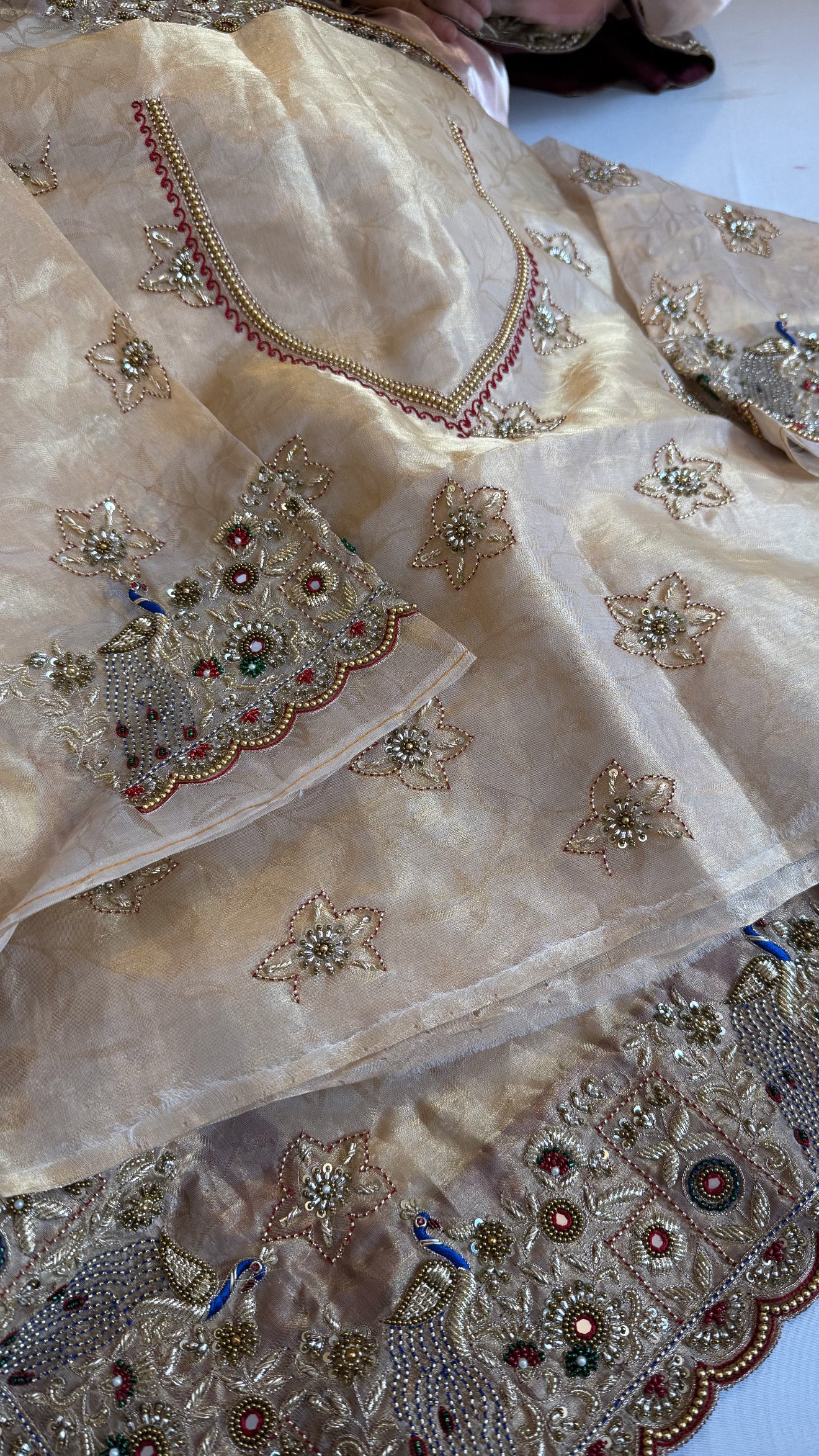 Jadau molten gold tissue silk hand embroidered peacock motif saree