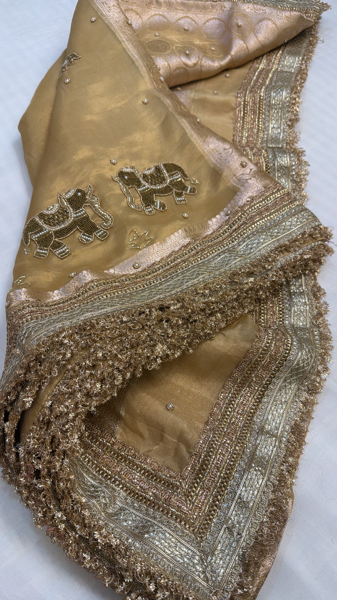Husn champagne gold tissue silk hand embroidered saree