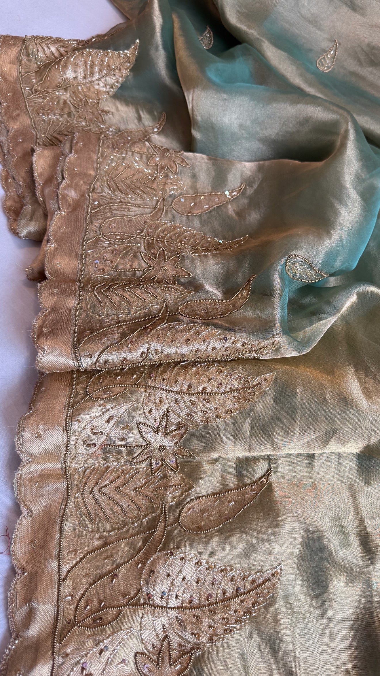 Husn candy green tissue silk heavy hand embroidered saree