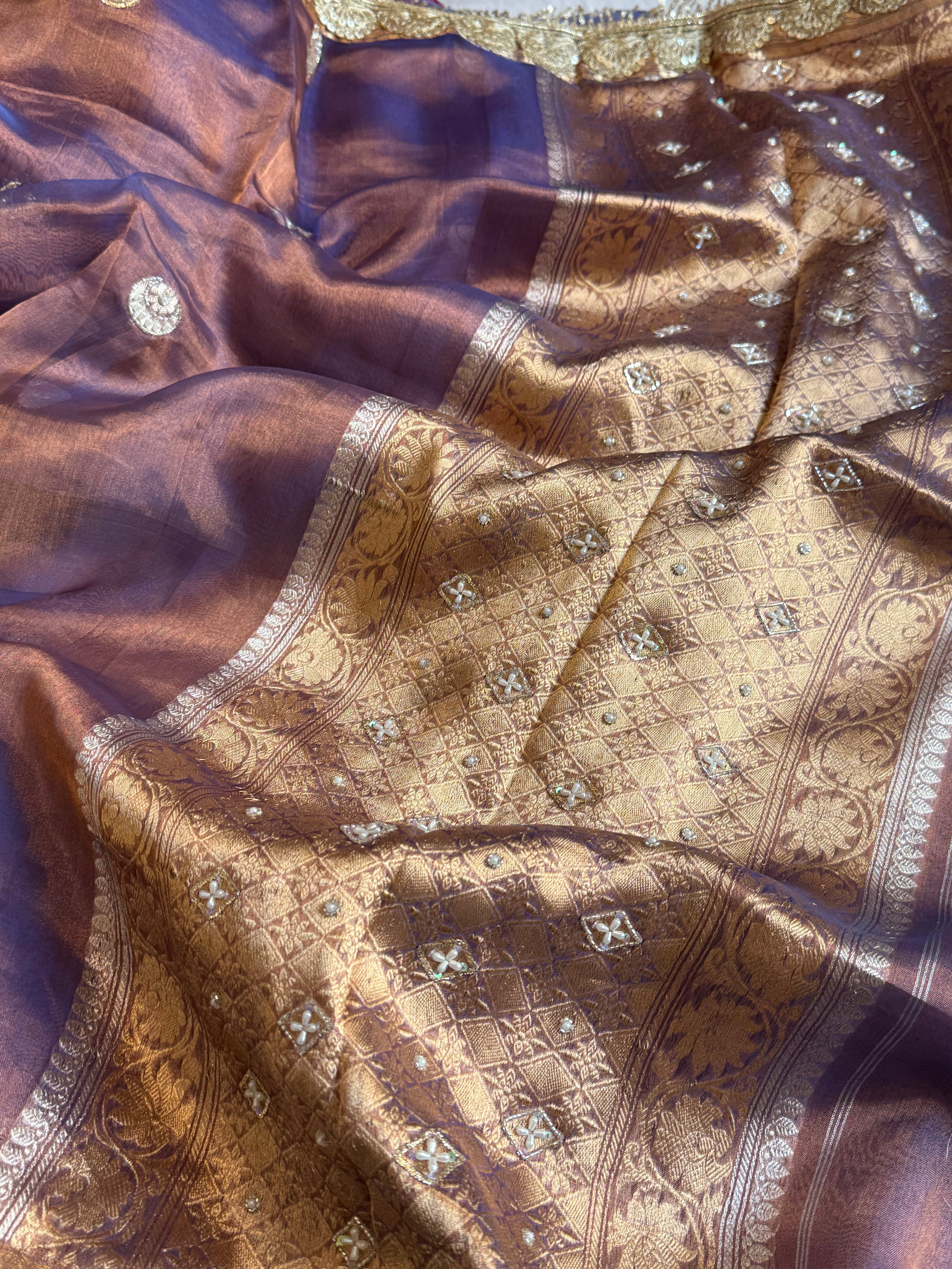 Chand tara copperish blue dhup chao effect tissue silk hand embroidered saree