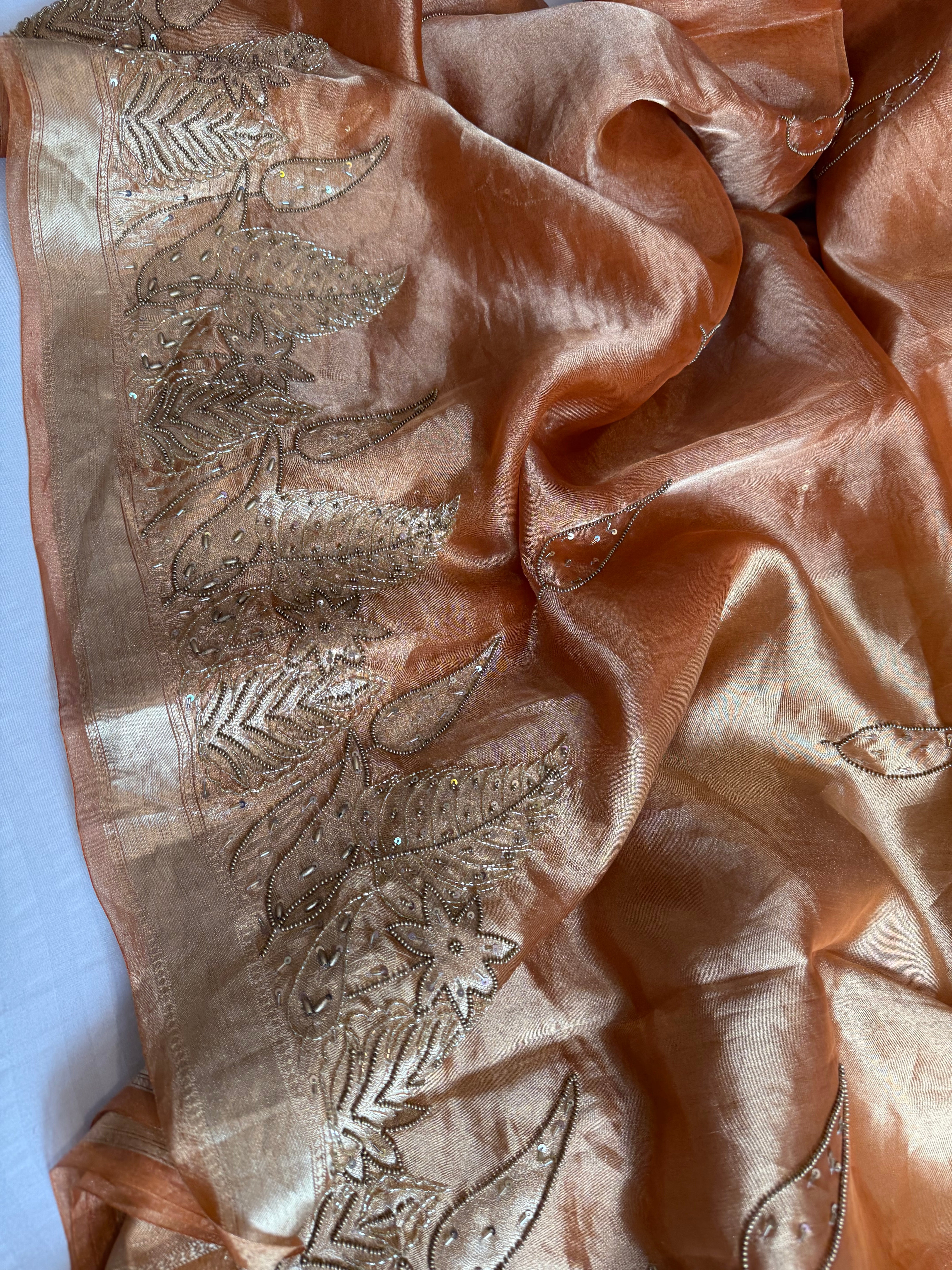 Husn tangerine red tissue silk heavy hand embroidered saree