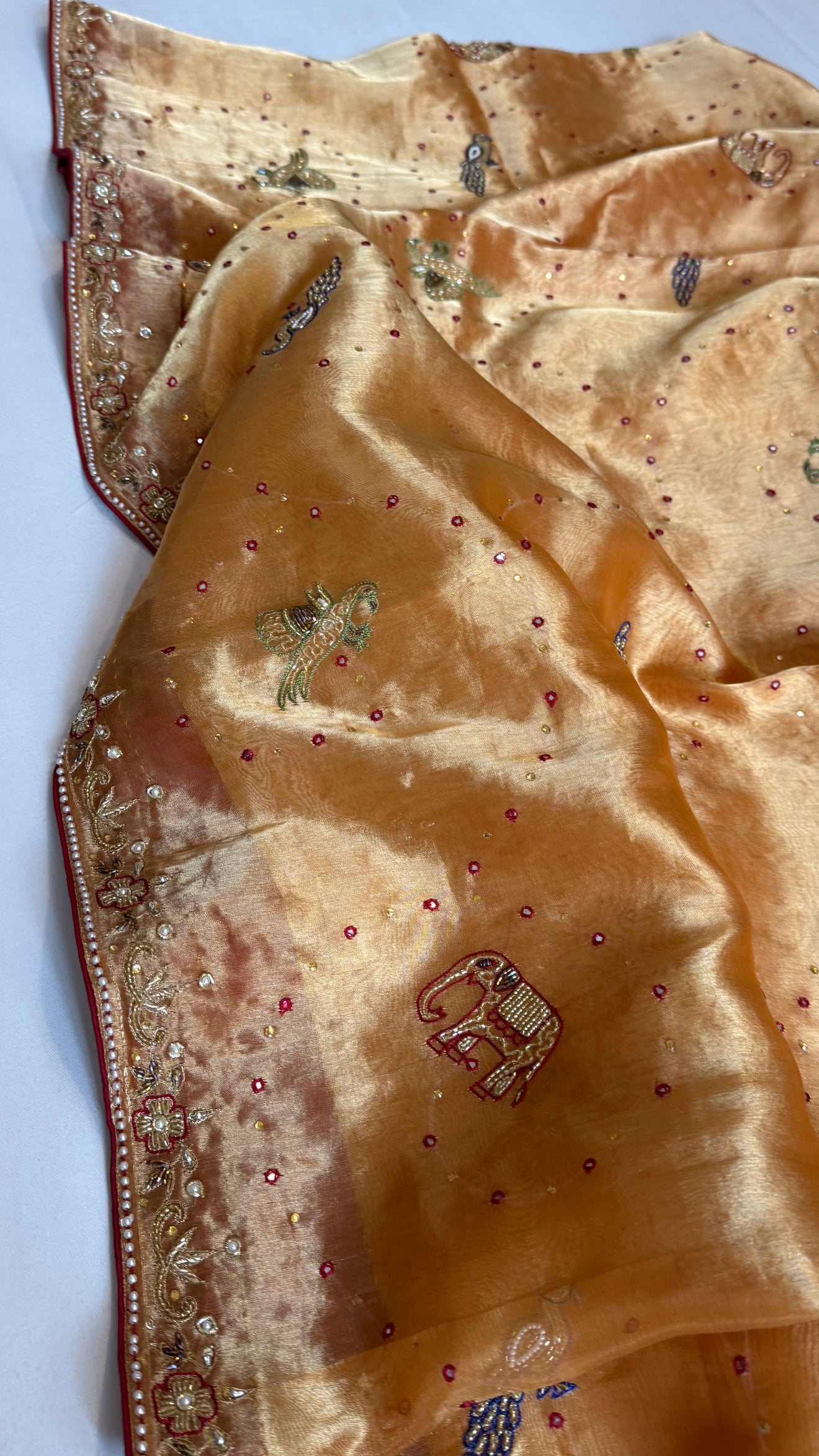 Shikarbagh edit spicy tangerine orange diamond tissue silk hand embroidered kadhwa saree