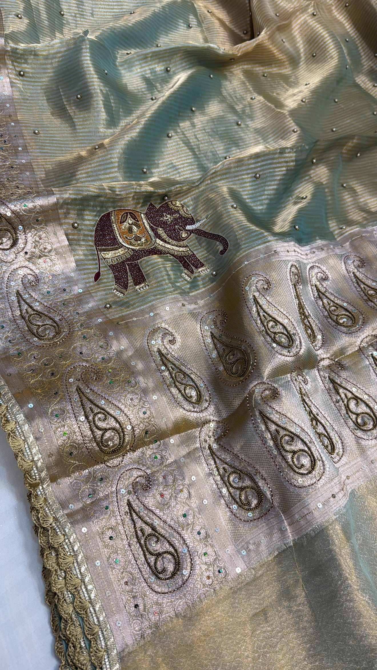 Molten gold-sage green tissue silk ombre shaded hand embroidered saree